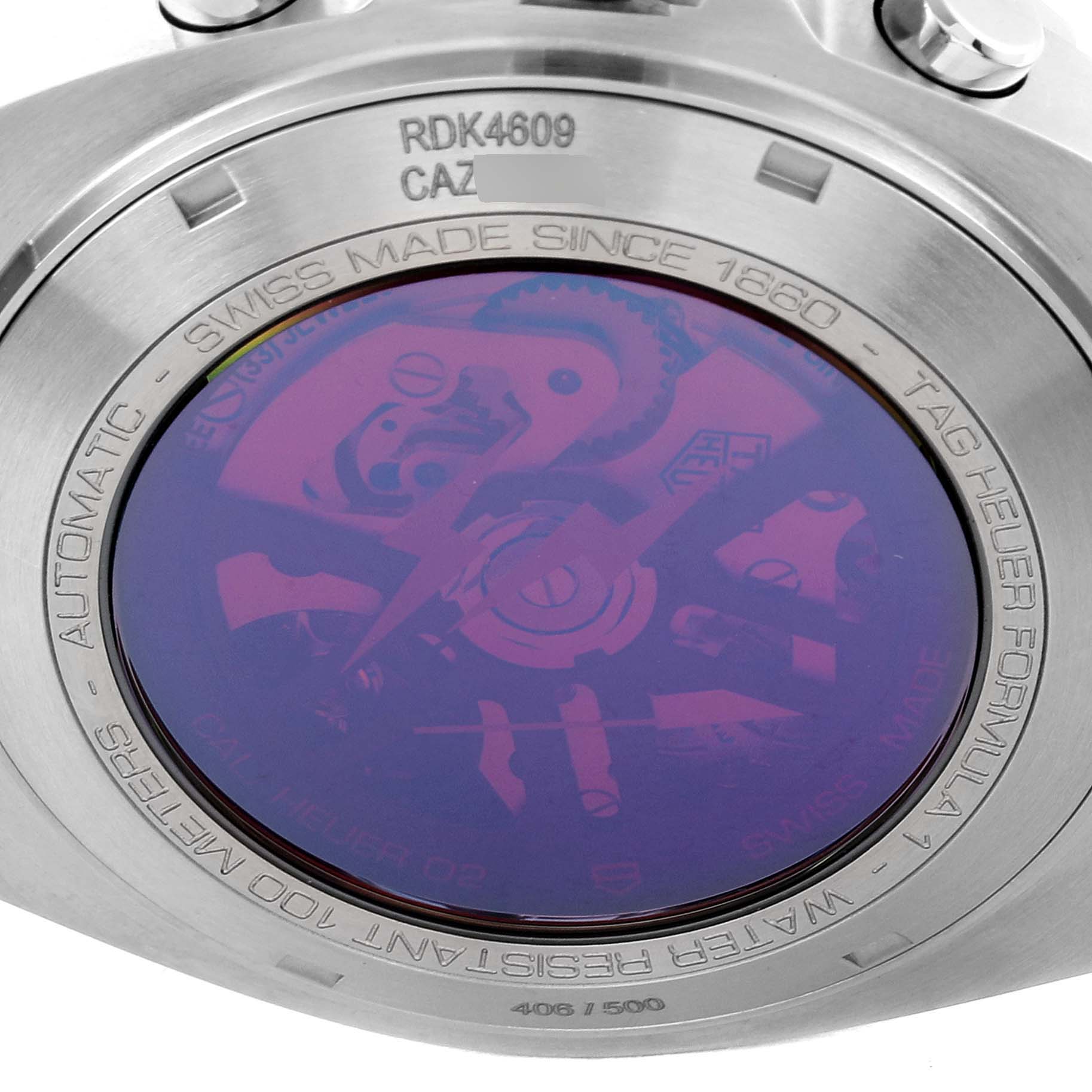 This image shows the back case of a Tag Heuer Formula 1 CAZ201A.BA0641 Men's Stainless Steel Black Dial CAZ201A.BA0641 Men's Stainless Steel Black Dial watch, revealing some internal components with text on the outer ring.