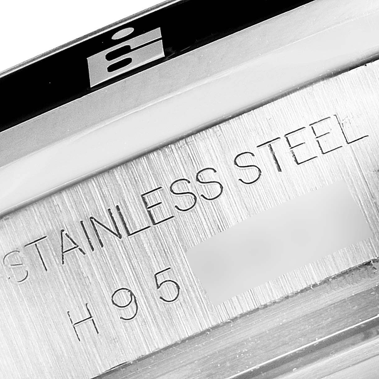 This image shows the engraved stainless steel case back of the Tudor Grantour 20350N Men's Stainless Steel Black Dial 20350N Men's Stainless Steel Black Dial watch.