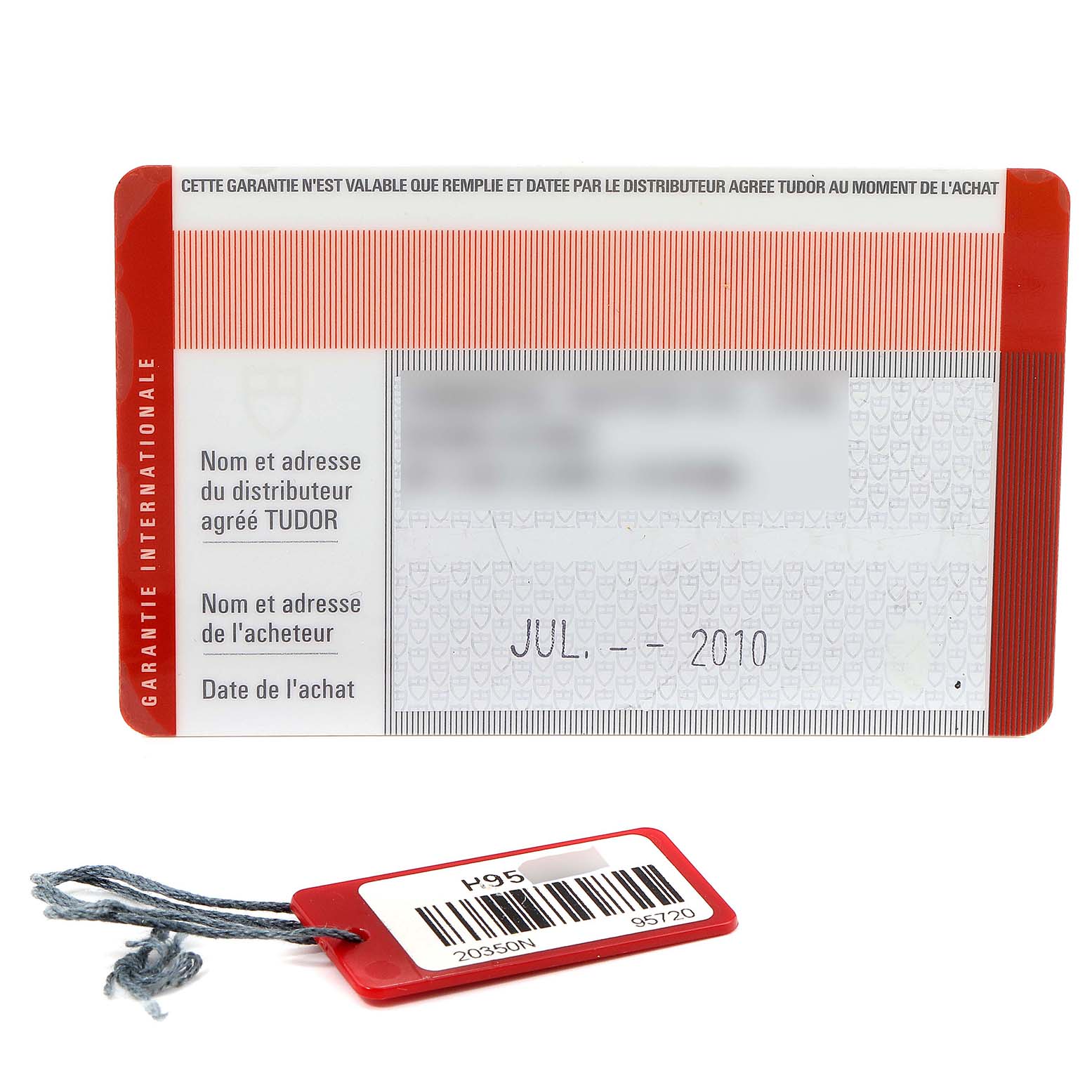 This image shows the warranty card and tag for the Tudor Grantour 20350N Men's Stainless Steel Black Dial 20350N Men's Stainless Steel Black Dial watch model.