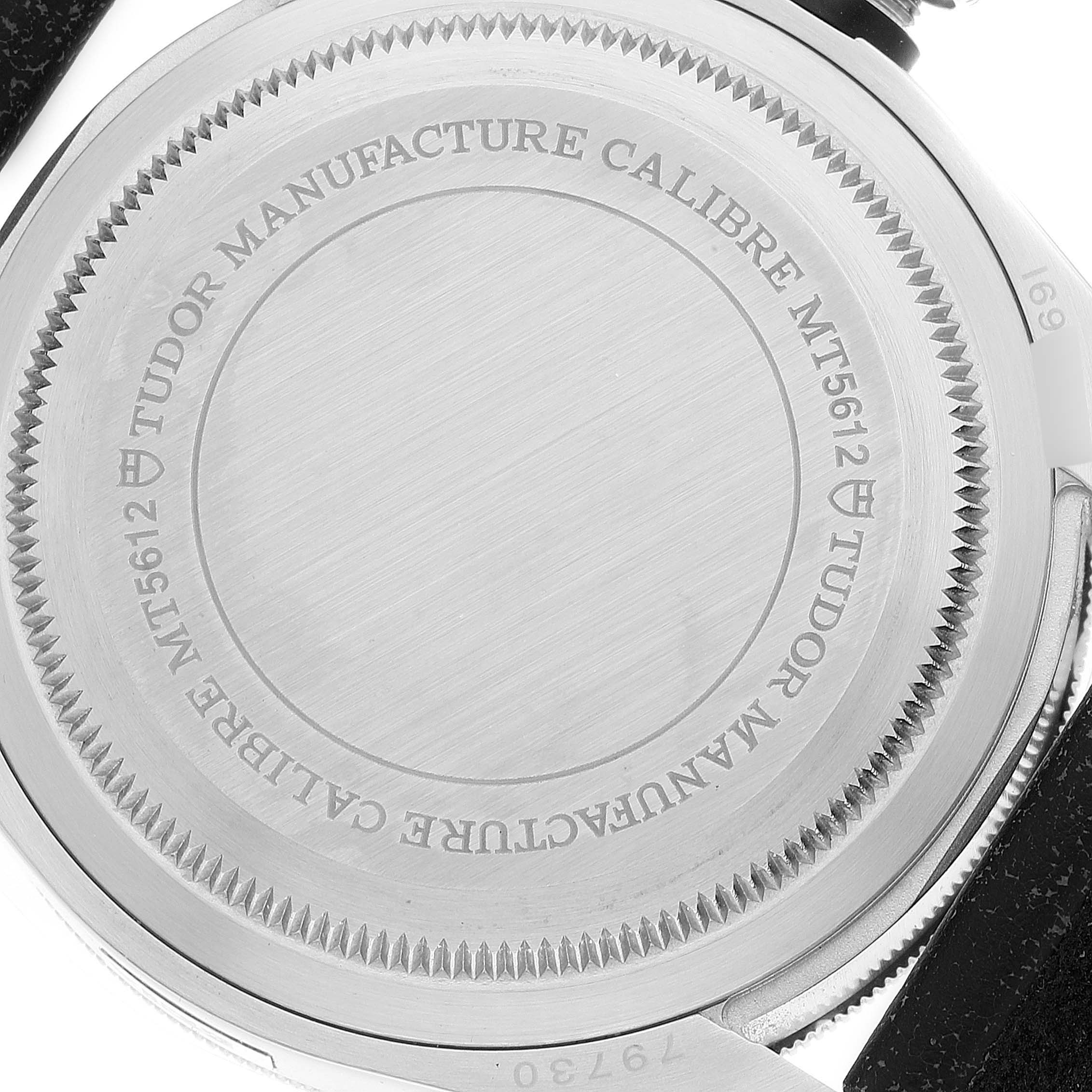 The image shows the back case of a Tudor Heritage Black Bay 55020 Men's Stainless Steel Black Dial 55020 Men's Stainless Steel Black Dial watch, highlighting the engraved details.