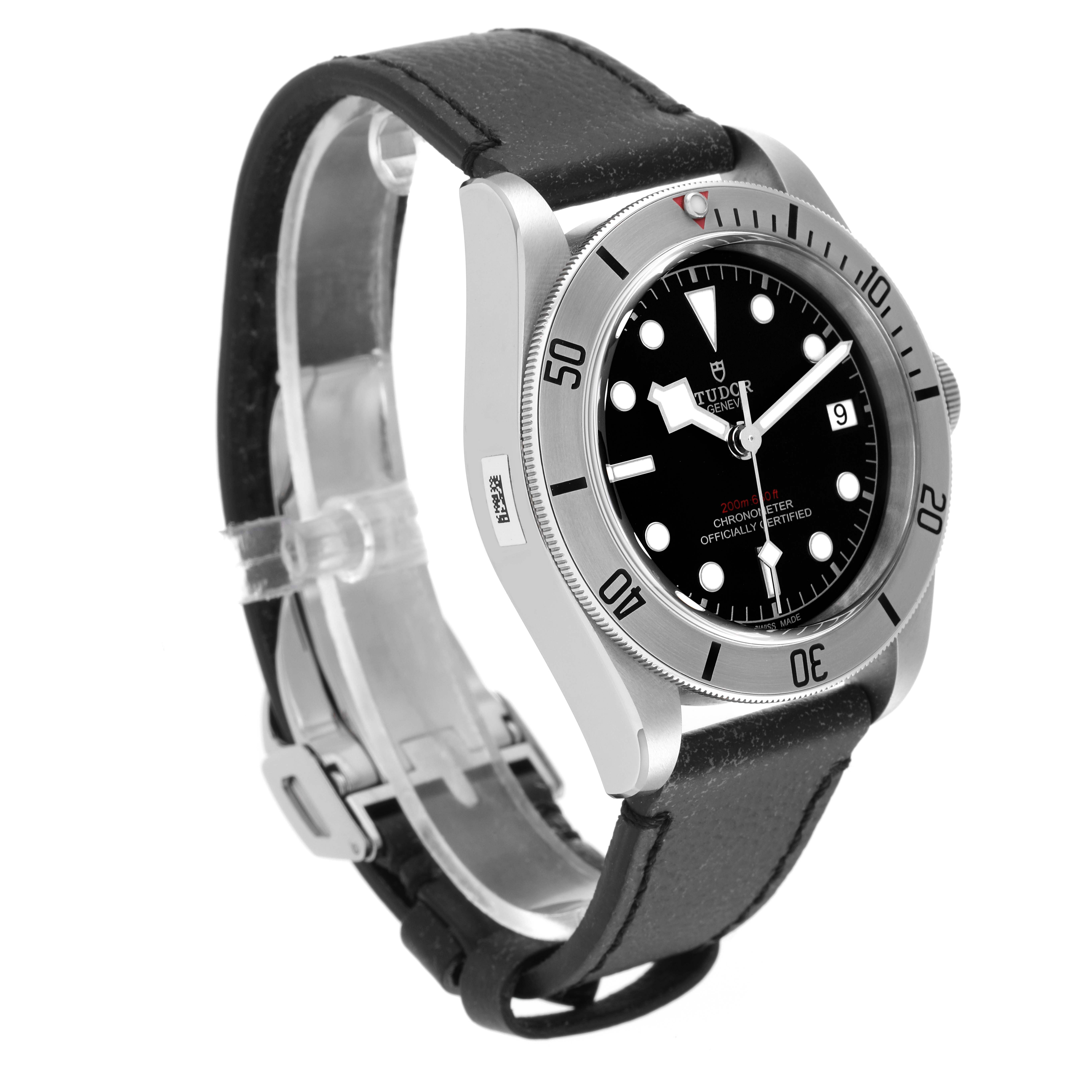 The Tudor Heritage Black Bay 55020 Men's Stainless Steel Black Dial 55020 Men's Stainless Steel Black Dial watch is shown at a slight angle, highlighting its bezel, dial, and leather strap.