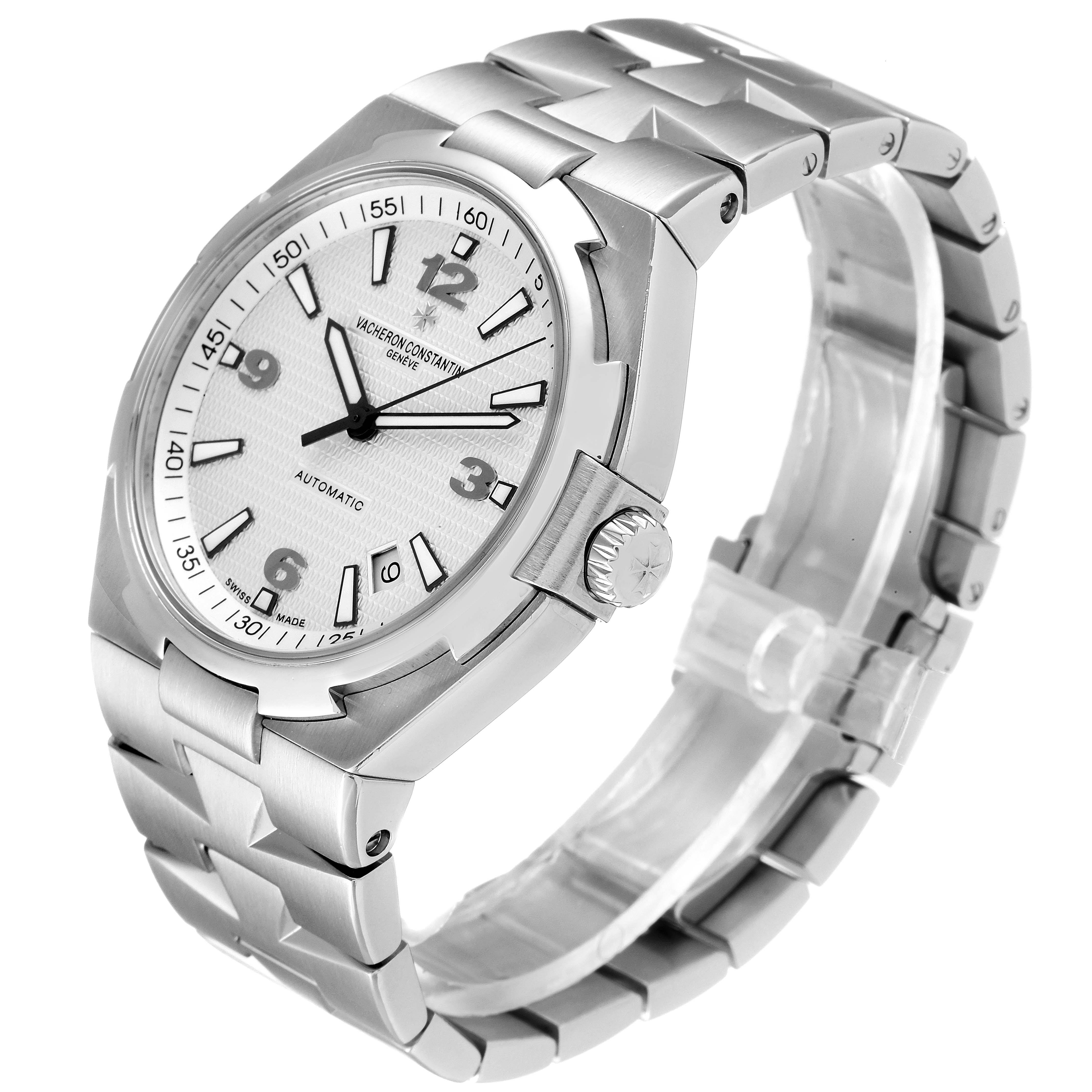 The Vacheron Constantin Overseas 47040B01A-9093 Men's Stainless Steel Silver Dial 47040B01A-9093 Men's Stainless Steel Silver Dial watch is shown at an angled view, highlighting the face, crown, and metal bracelet.