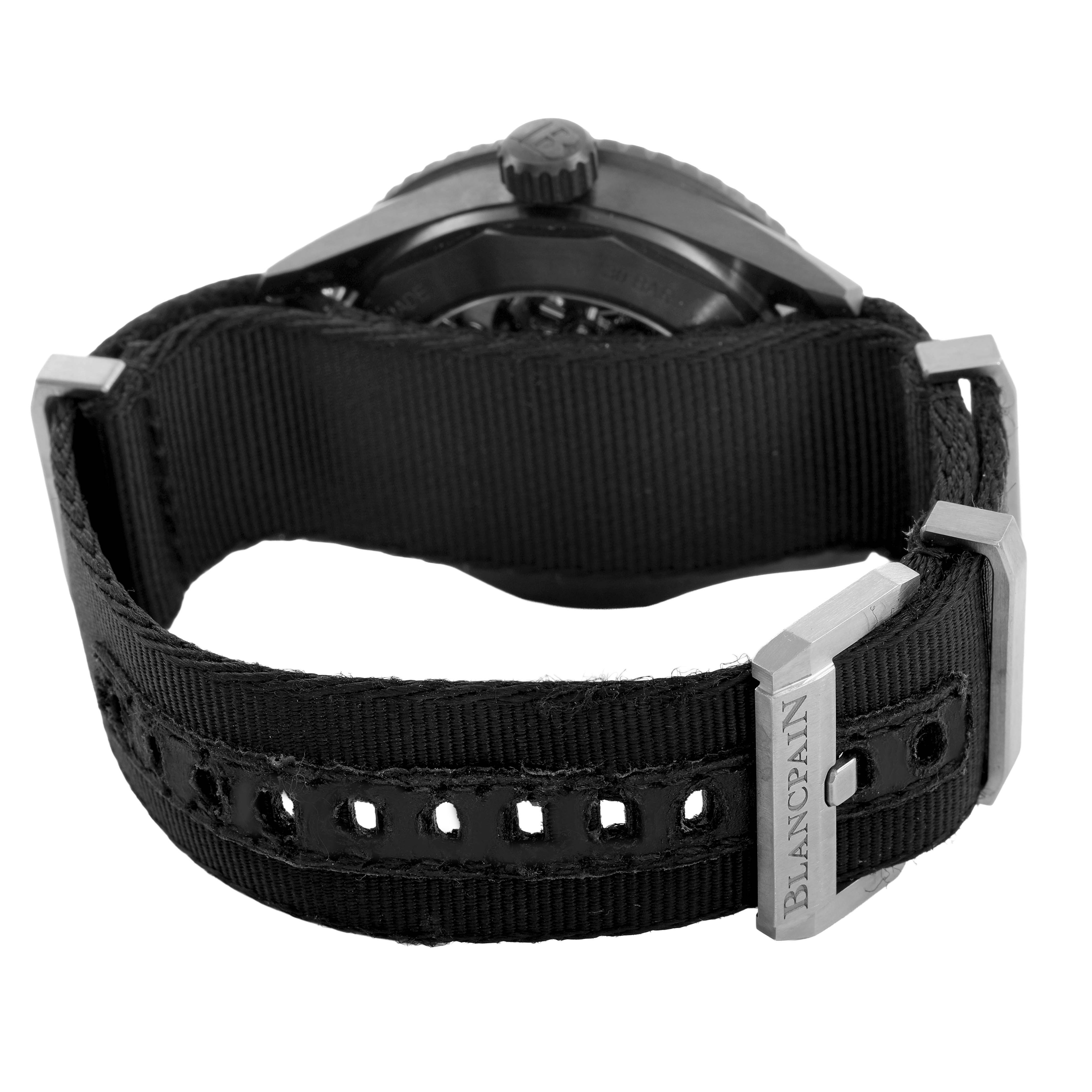 The image shows a rear angle of the Blancpain Fifty Fathoms 5000-0130-B52A Men's Stainless Steel Black Dial watch, highlighting the strap, buckle, and case back.