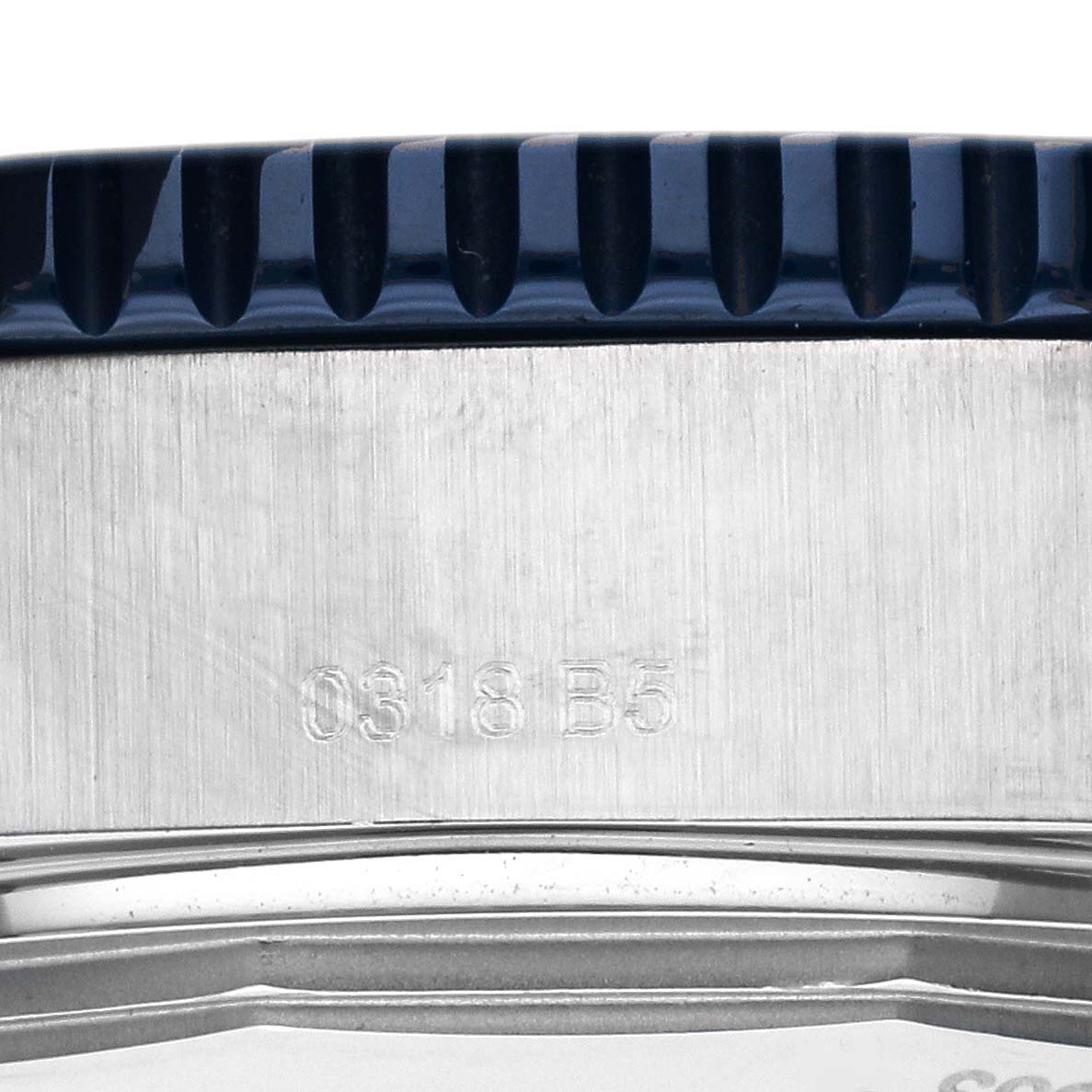 The image shows a close-up of the side of a Breitling Superocean Y17393 Men's Stainless Steel Blue Dial Y17393 Men's Stainless Steel Blue Dial watch, focusing on the case and partially on the bezel.