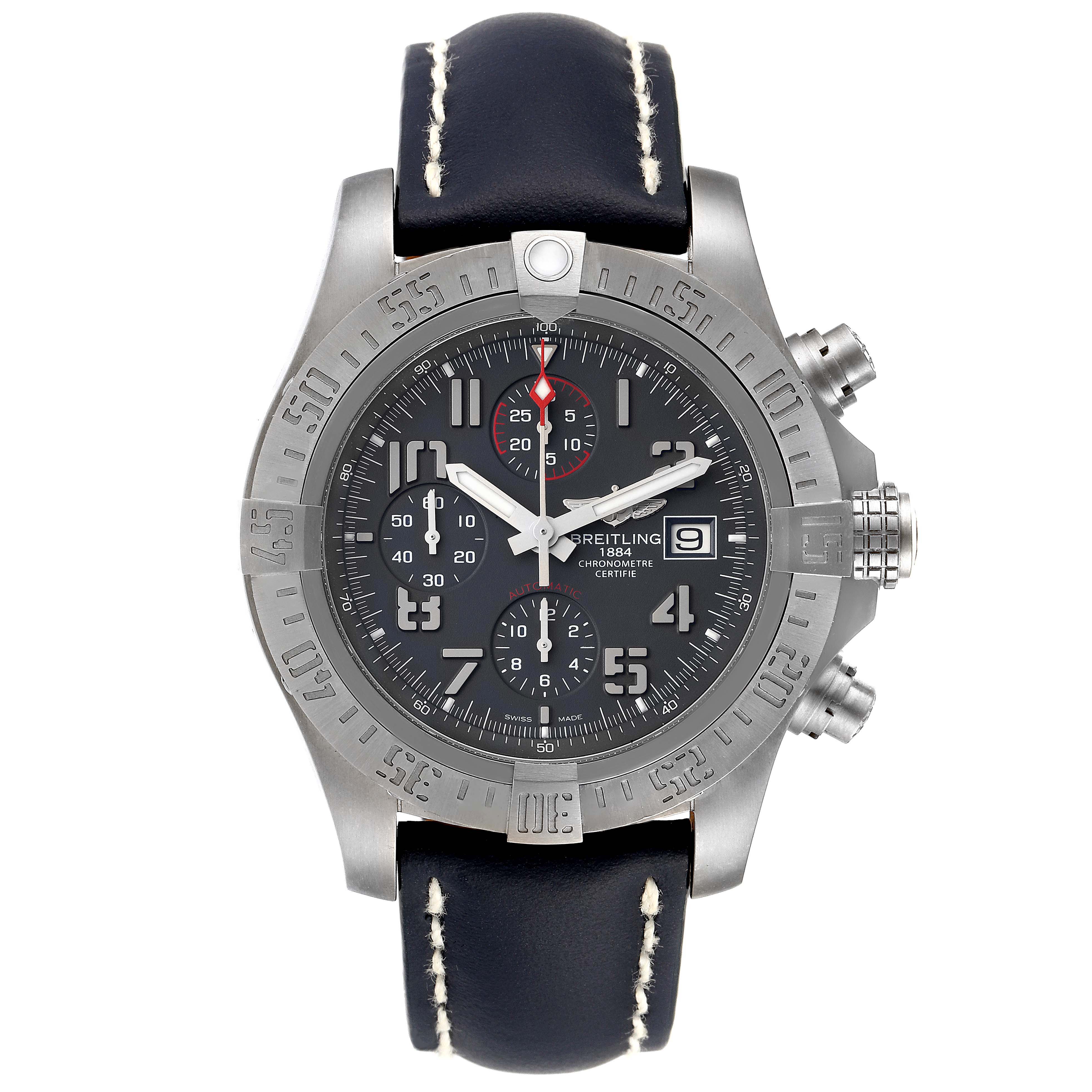 The Breitling Avenger E1338310/M536-109W Men's Titanium Grey Dial E1338310/M536-109W Men's Titanium Grey Dial watch is shown from the front, displaying its black dial, chronograph subdials, and leather strap with white stitching.