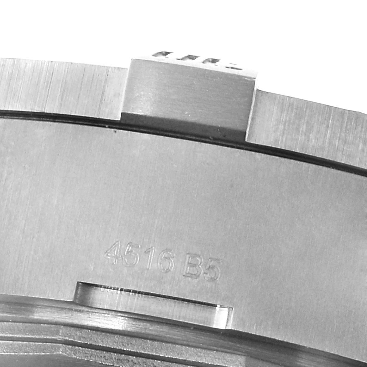 The image shows a close-up of the side of a Breitling Avenger E1338310/M536-109W Men's Titanium Grey Dial E1338310/M536-109W Men's Titanium Grey Dial watch, revealing part of its case and bezel with the engraving "4516 B5".