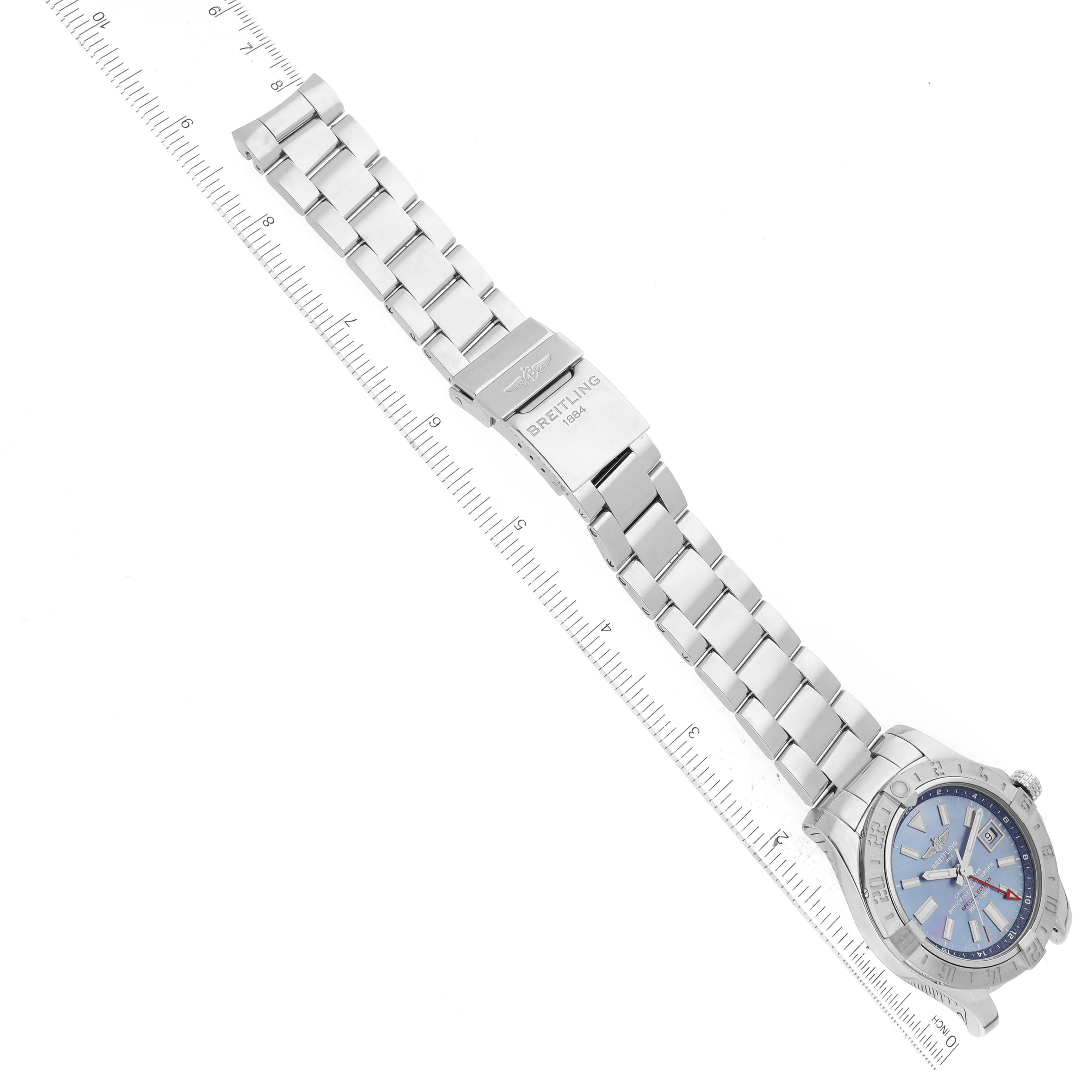 The Breitling Avenger A3239011/C930 Men's Stainless Steel Mother of Pearl Dial A3239011/C930 Men's Stainless Steel Mother of Pearl Dial watch is shown from an angled top view, displaying its blue dial, bezel, and metal bracelet with clasp.
