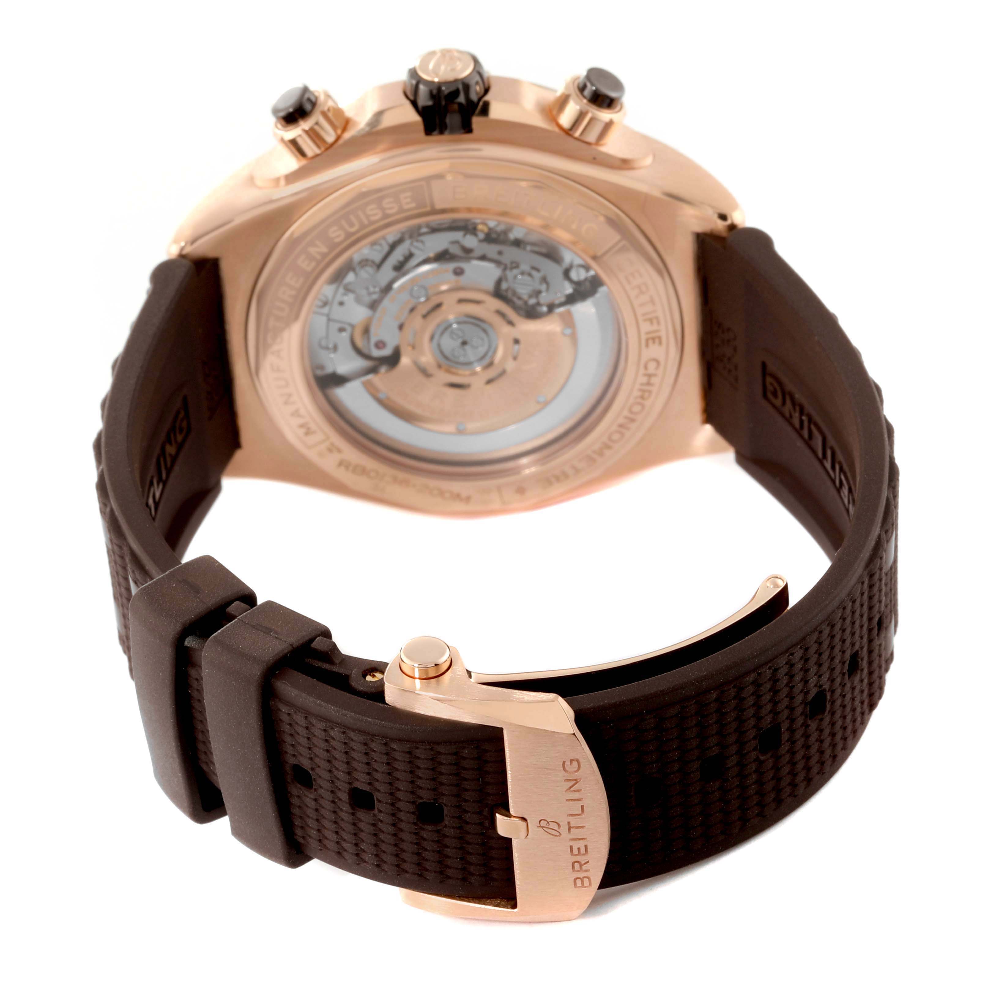 This image shows the back and clasp of the Breitling Chronomat RB0136E31Q1S1 Men's Rose Gold Brown Dial RB0136E31Q1S1 Men's Rose Gold Brown Dial watch, highlighting its mechanical movement and rubber strap.