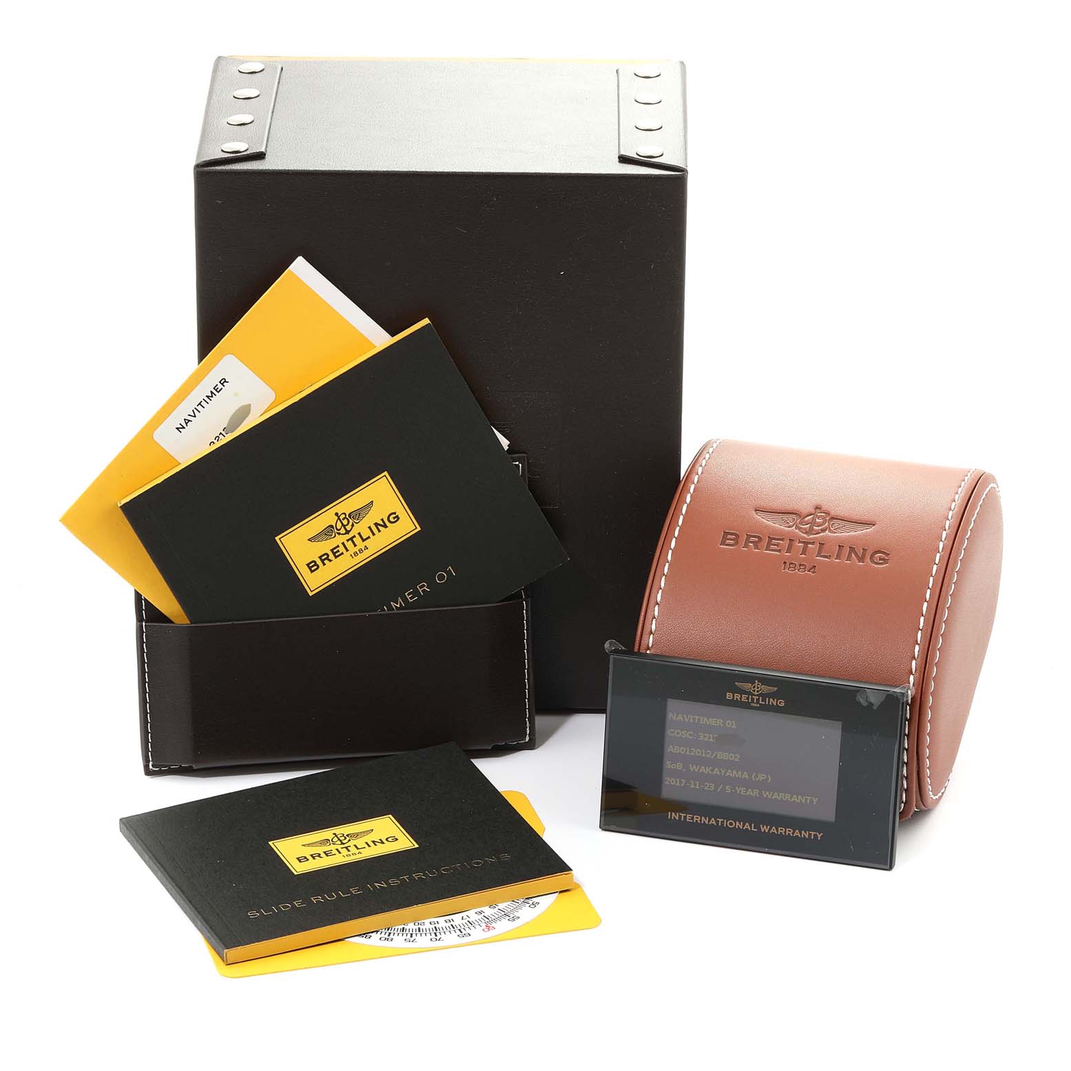 The image shows a Breitling Navitimer AB0120 Men's Stainless Steel Black Dial AB0120 Men's Stainless Steel Black Dial watch box, instruction manuals, and a warranty card from a front angle.