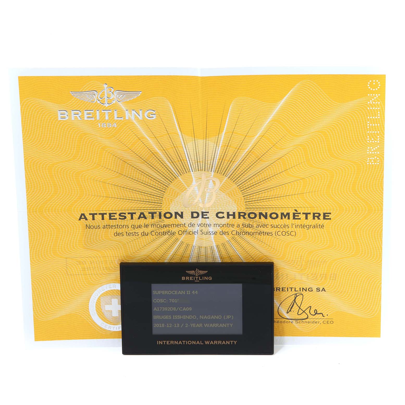 The image shows a Breitling Superocean A17392 Men's Stainless Steel Blue Dial A17392 Men's Stainless Steel Blue Dial watch's international warranty card and COSC attestation certificate, both displayed frontally.