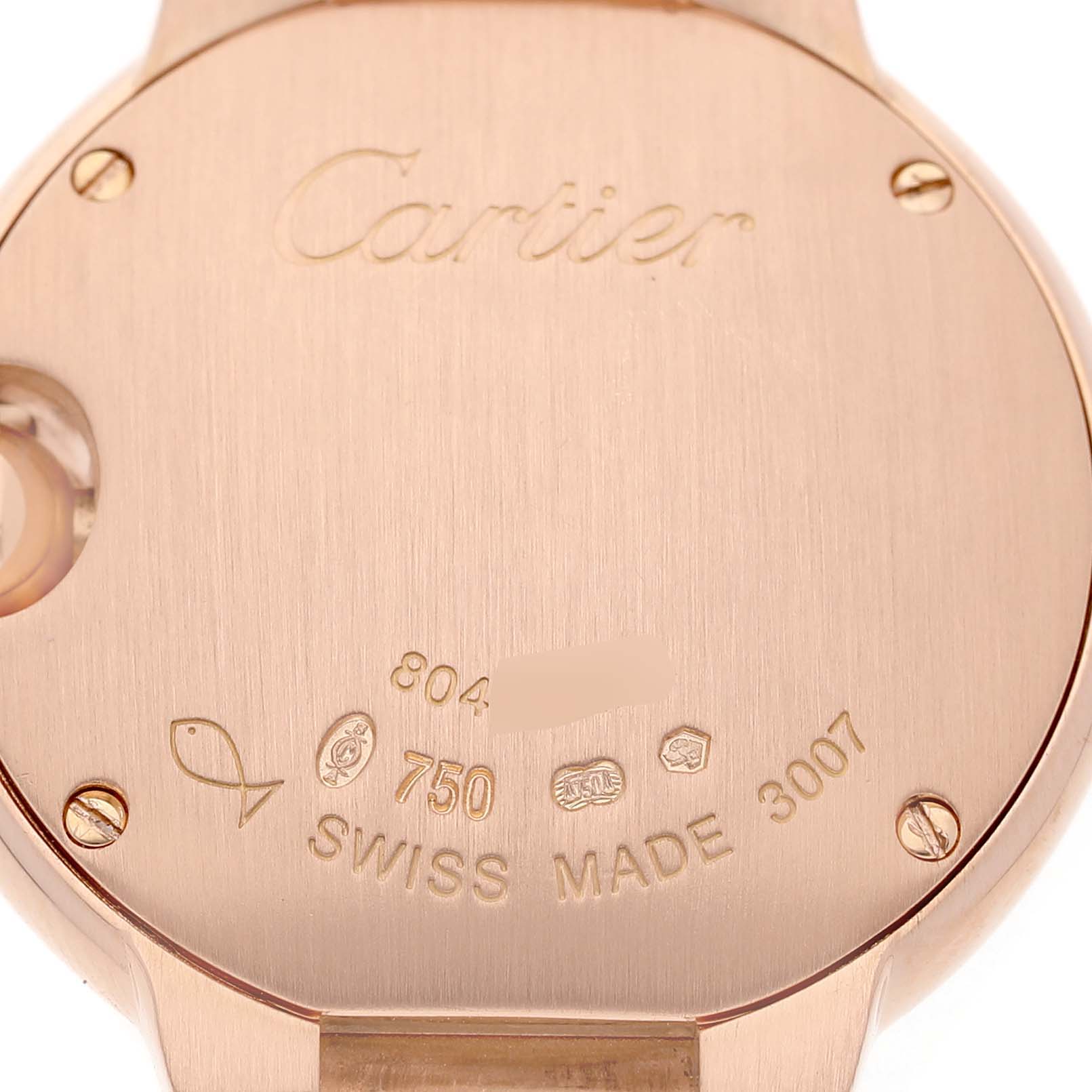 The image shows the back case of a Cartier Ballon Bleu W69002Z2 Women's Rose Gold Silver Dial watch, highlighting engravings and gold screws.