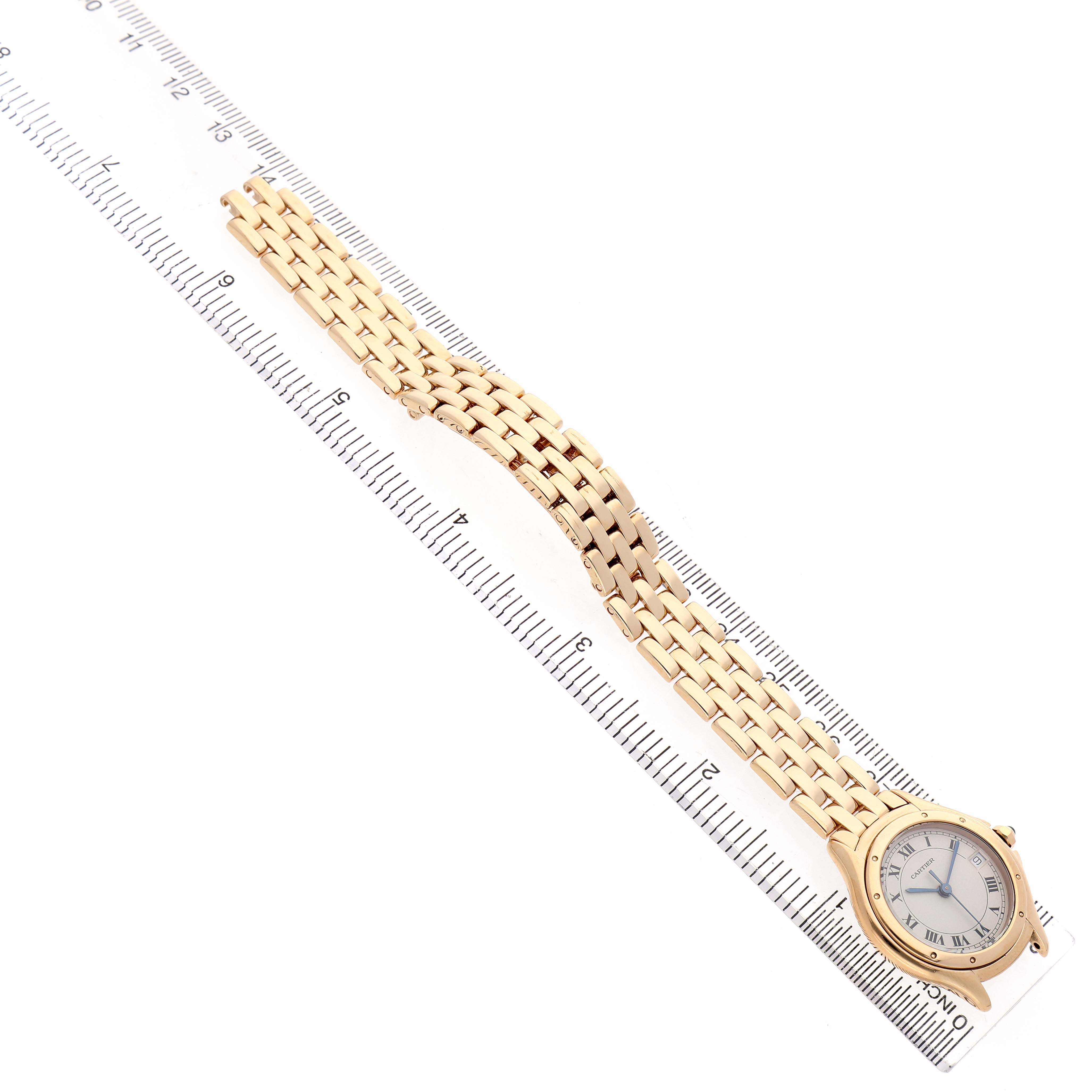 The Cartier Panthere 887906 Women's Yellow Gold Silver Dial watch is shown from a top-down angle, displaying the face and full bracelet length along a ruler.