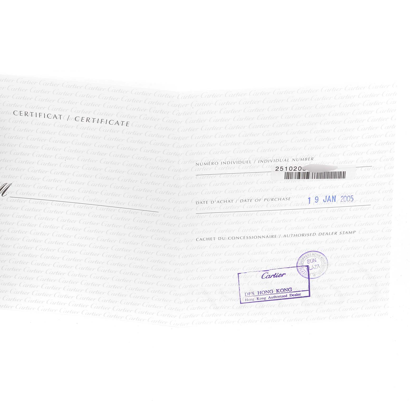 The image shows the certificate of a Roadster model by Cartier, including the individual number, purchase date, and dealer stamp.