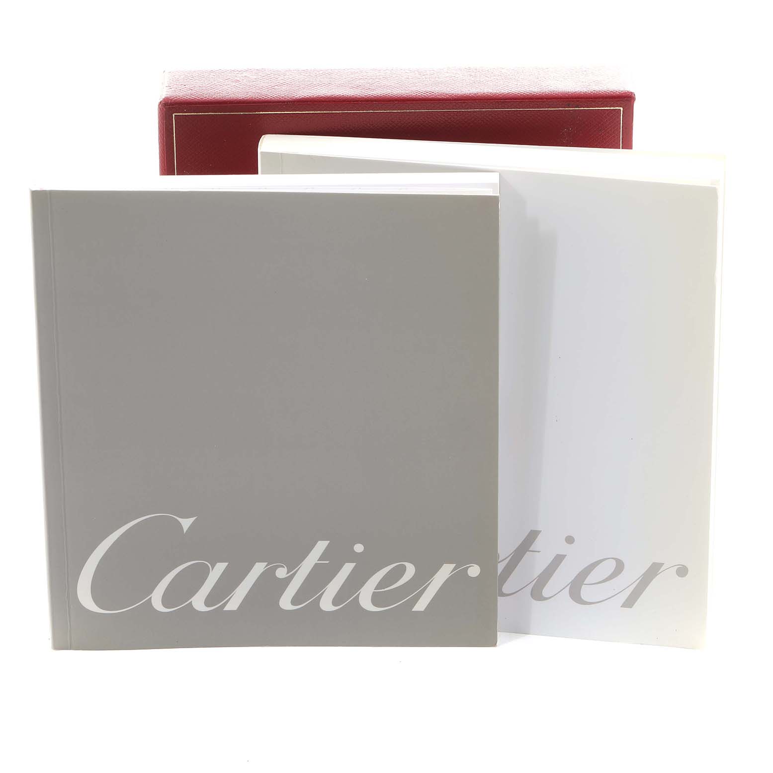 The image shows a box and manuals for the Cartier Roadster W62016V3 Women's Stainless Steel Silver Dial, displaying accessories but not the watch itself.