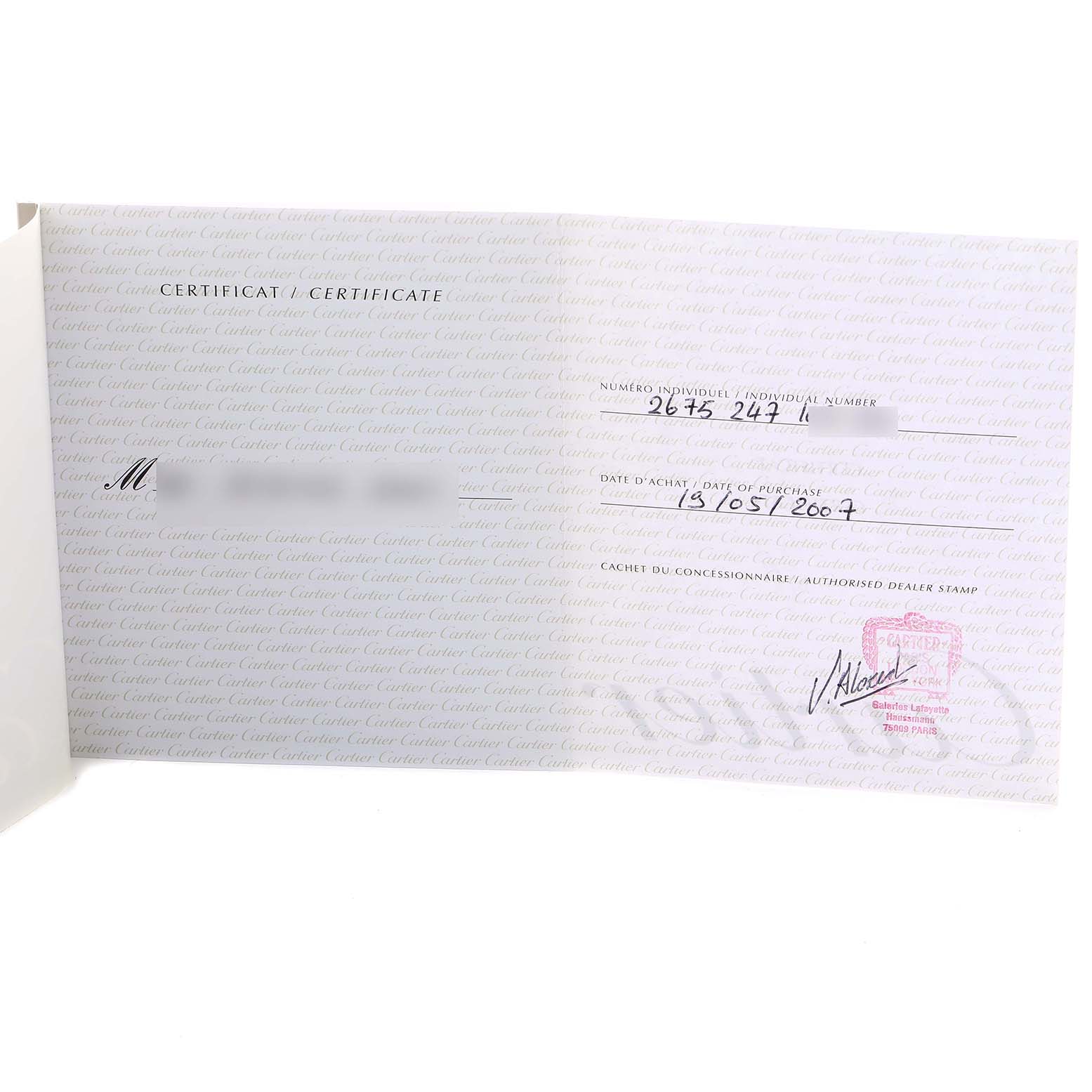 The image shows an open warranty certificate for the Roadster model by Cartier, displaying purchase details and dealer stamp.