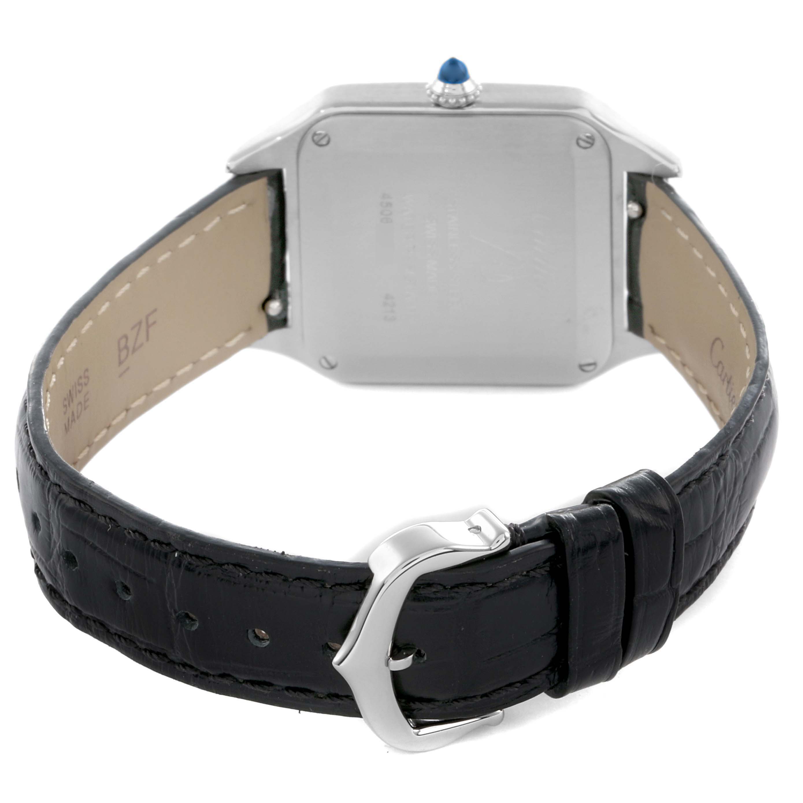 The image shows the back of the Santos model by Cartier, displaying the case back, leather strap, and buckle.