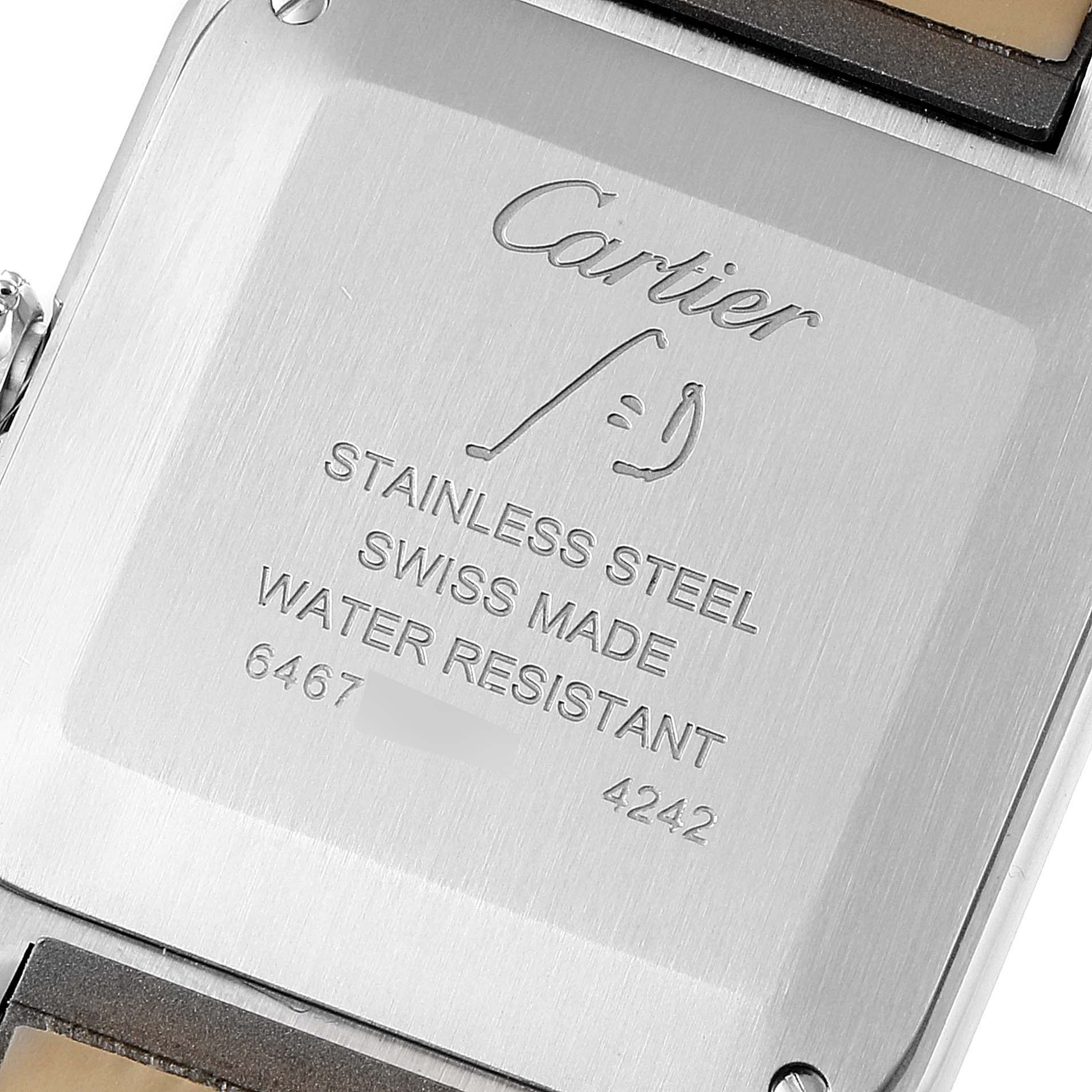 The image shows the back case of a Cartier Santos WSSA0023 Women's Stainless Steel Silver Dial WSSA0023 Women's Stainless Steel Silver Dial watch, highlighting its stainless steel composition and Swiss craftsmanship.