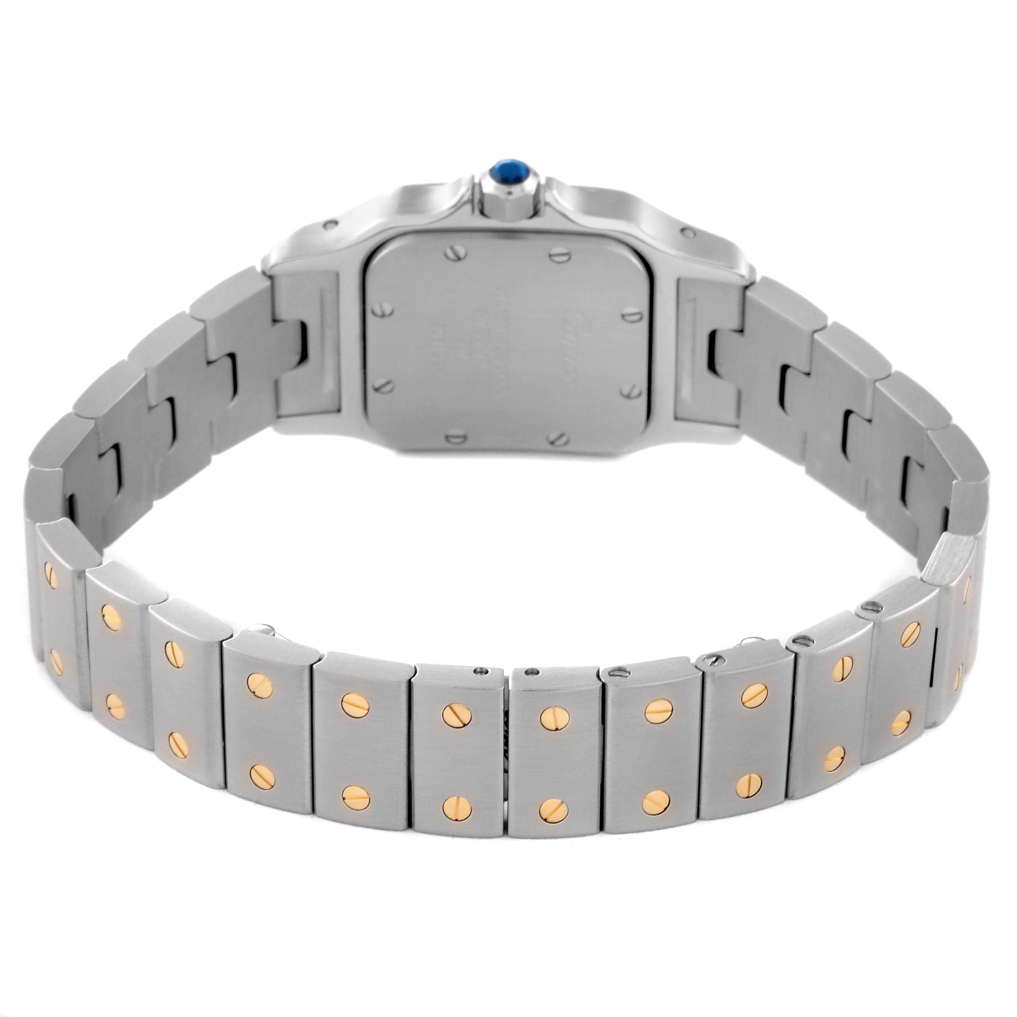 This image displays the back view of the Santos de Cartier watch, focusing on the bracelet and case back.