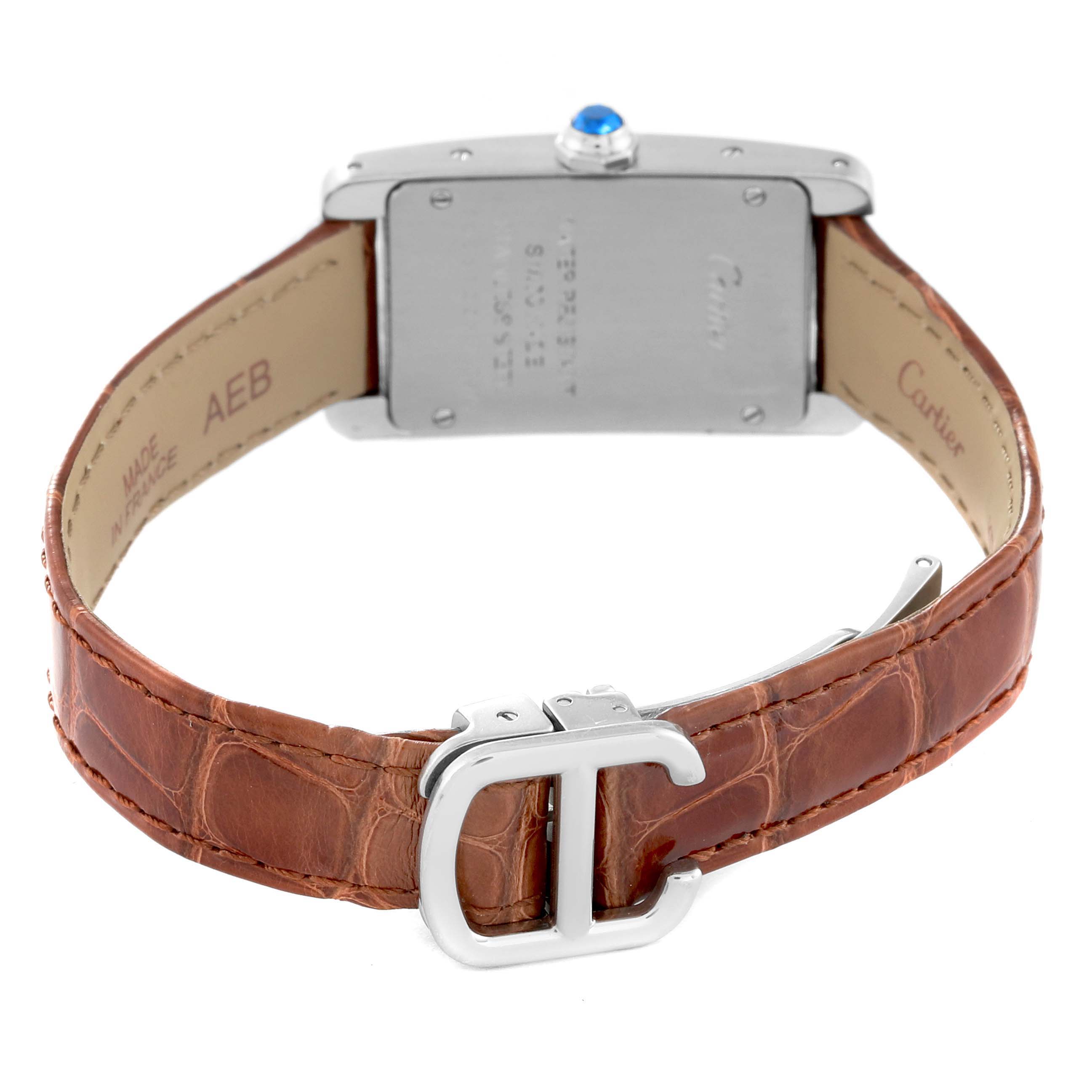 This is the back view of a Cartier Tank Americaine WSTA0016 Women's Stainless Steel Silver Dial WSTA0016 Women's Stainless Steel Silver Dial watch, showing the case back, leather strap, and deployment clasp.
