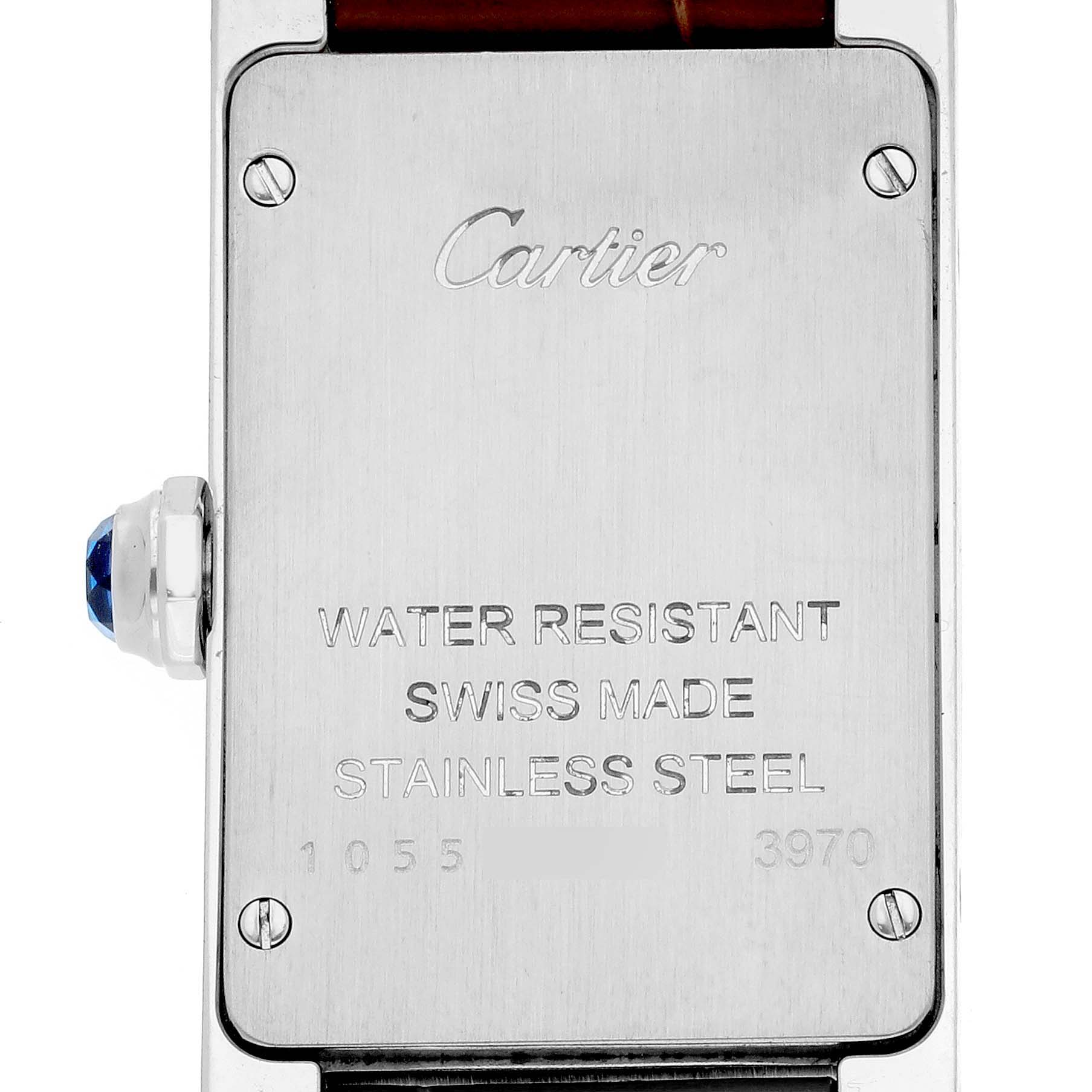 The image shows the back case of a Cartier Tank Americaine WSTA0016 Women's Stainless Steel Silver Dial WSTA0016 Women's Stainless Steel Silver Dial watch, highlighting its water resistance, Swiss-made label, and stainless steel material.