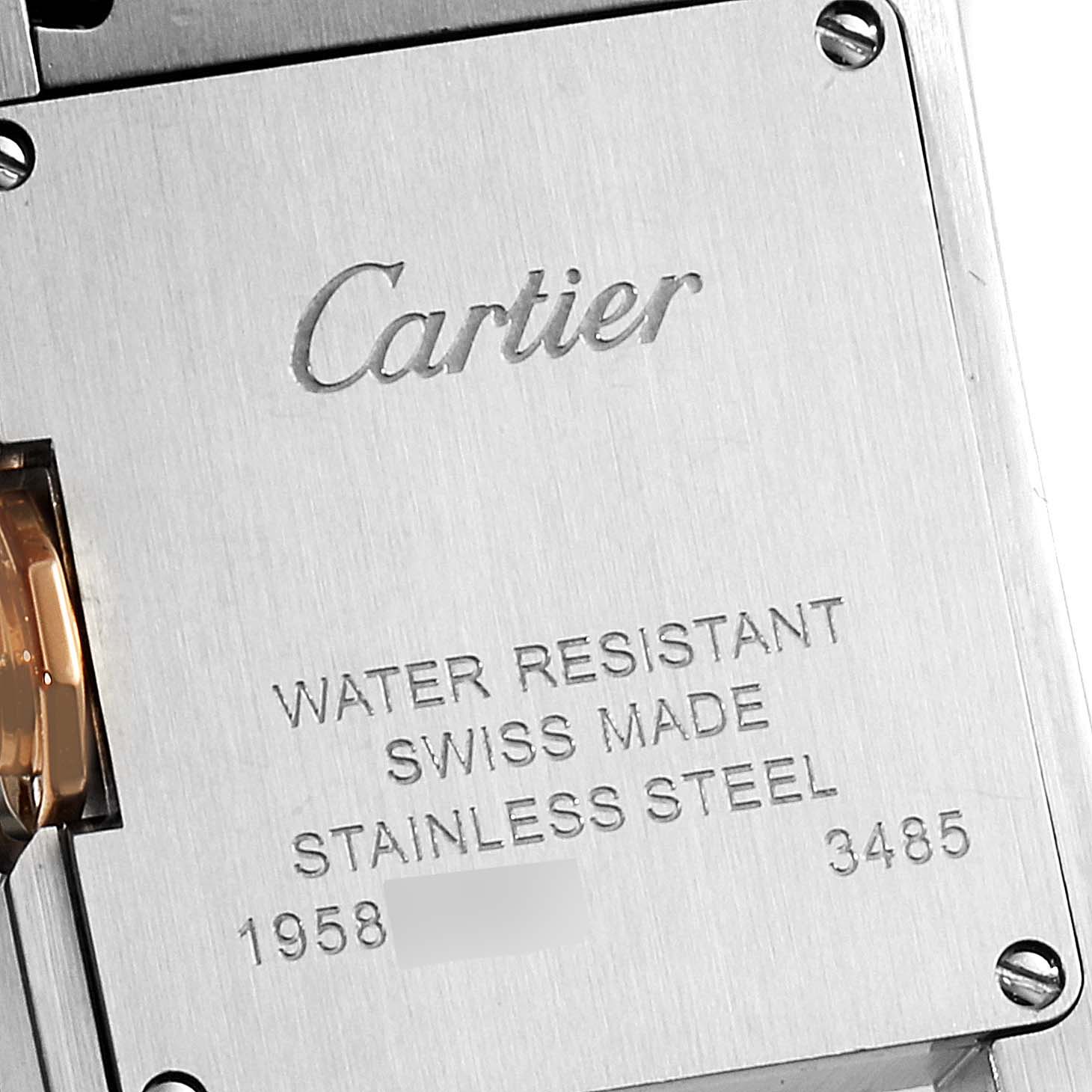 This image shows the back of a Cartier Tank Anglaise W5310019 Women's Steel and Gold (two tone) Silver Dial W5310019 Women's Steel and Gold (two tone) Silver Dial watch, highlighting the brand name, material, and other specifications.