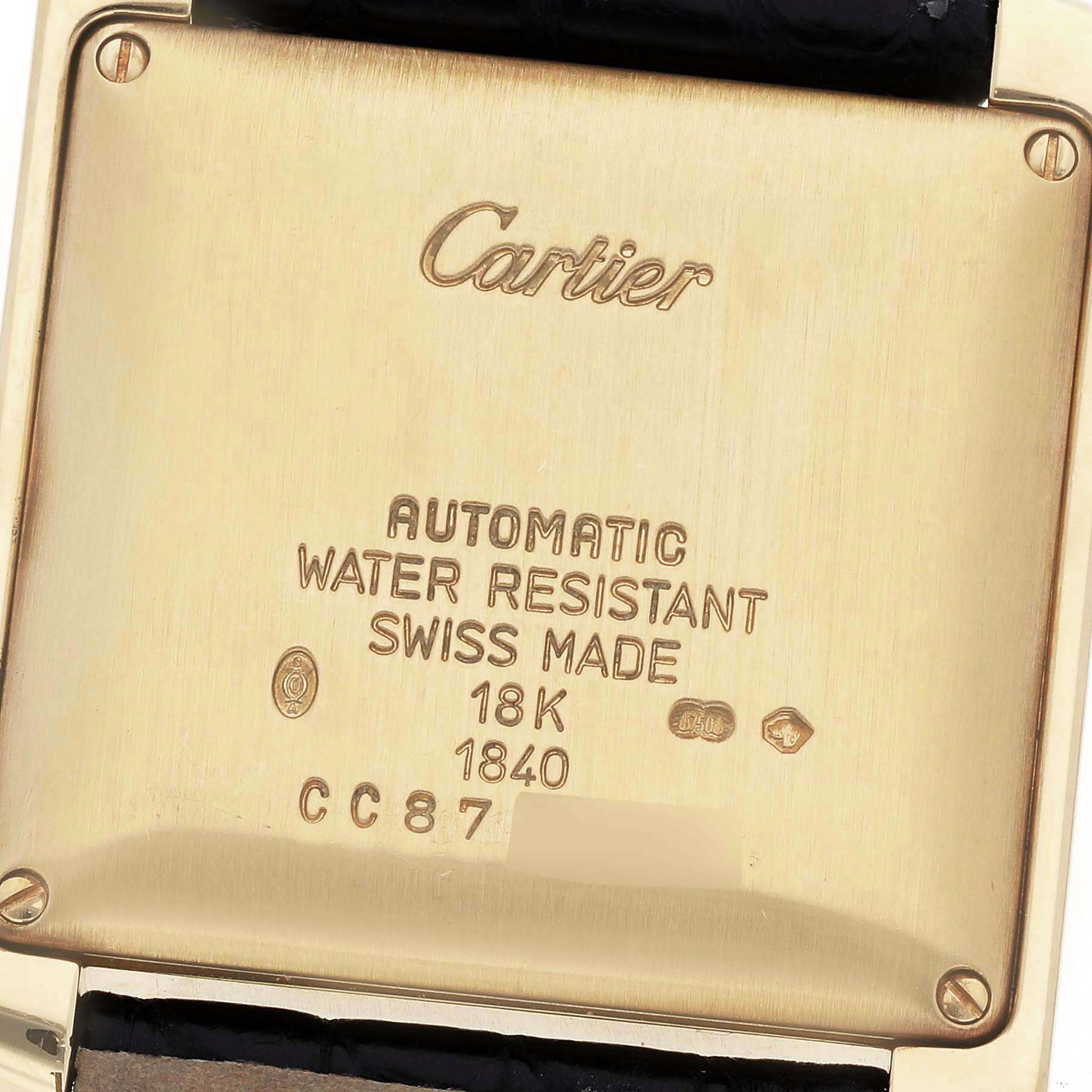 The image shows the back case of a Cartier Tank Française watch, displaying the brand, model details, and specifications.