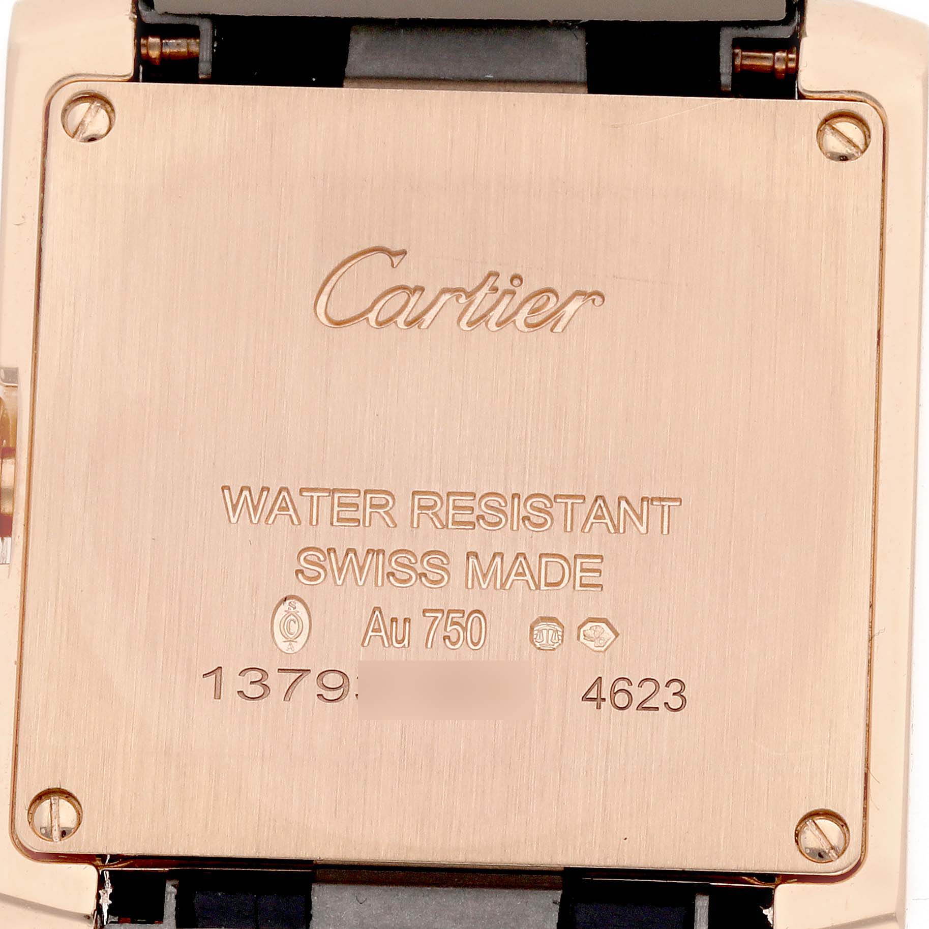 The image shows the back case of a Cartier Tank Française watch, highlighting engravings and the strap attachment.