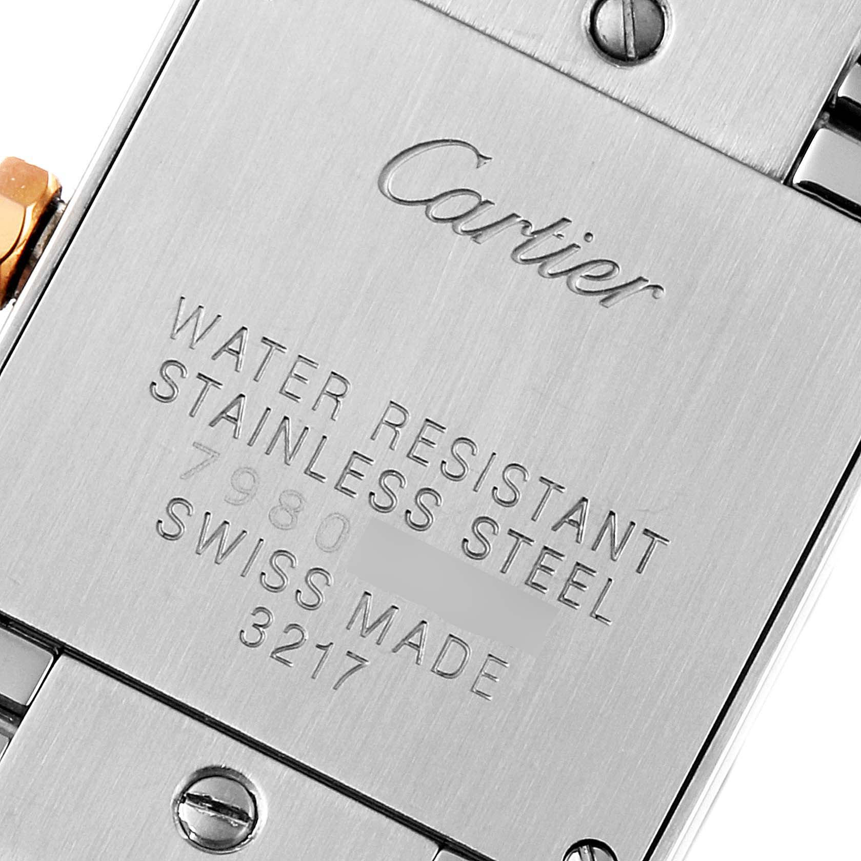 This is a close-up of the back of a Cartier Tank Française watch, showing the brand, model details, and material information.
