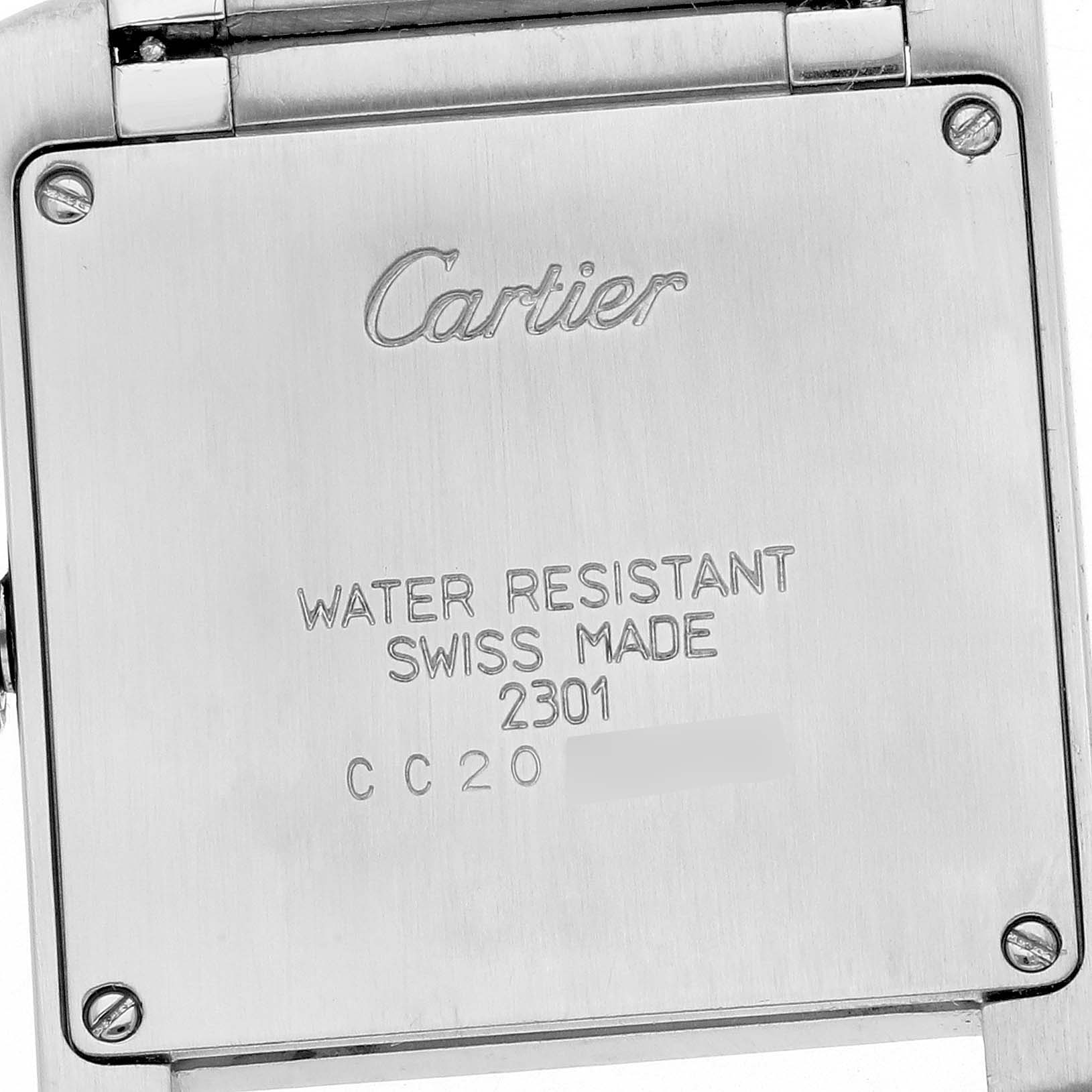 This image shows the back case of a Cartier Tank Francaise W51006Q4 Women's Steel and Gold (two tone) Silver Dial W51006Q4 Women's Steel and Gold (two tone) Silver Dial watch at a close-up angle, highlighting the "Cartier" inscription and specifications.