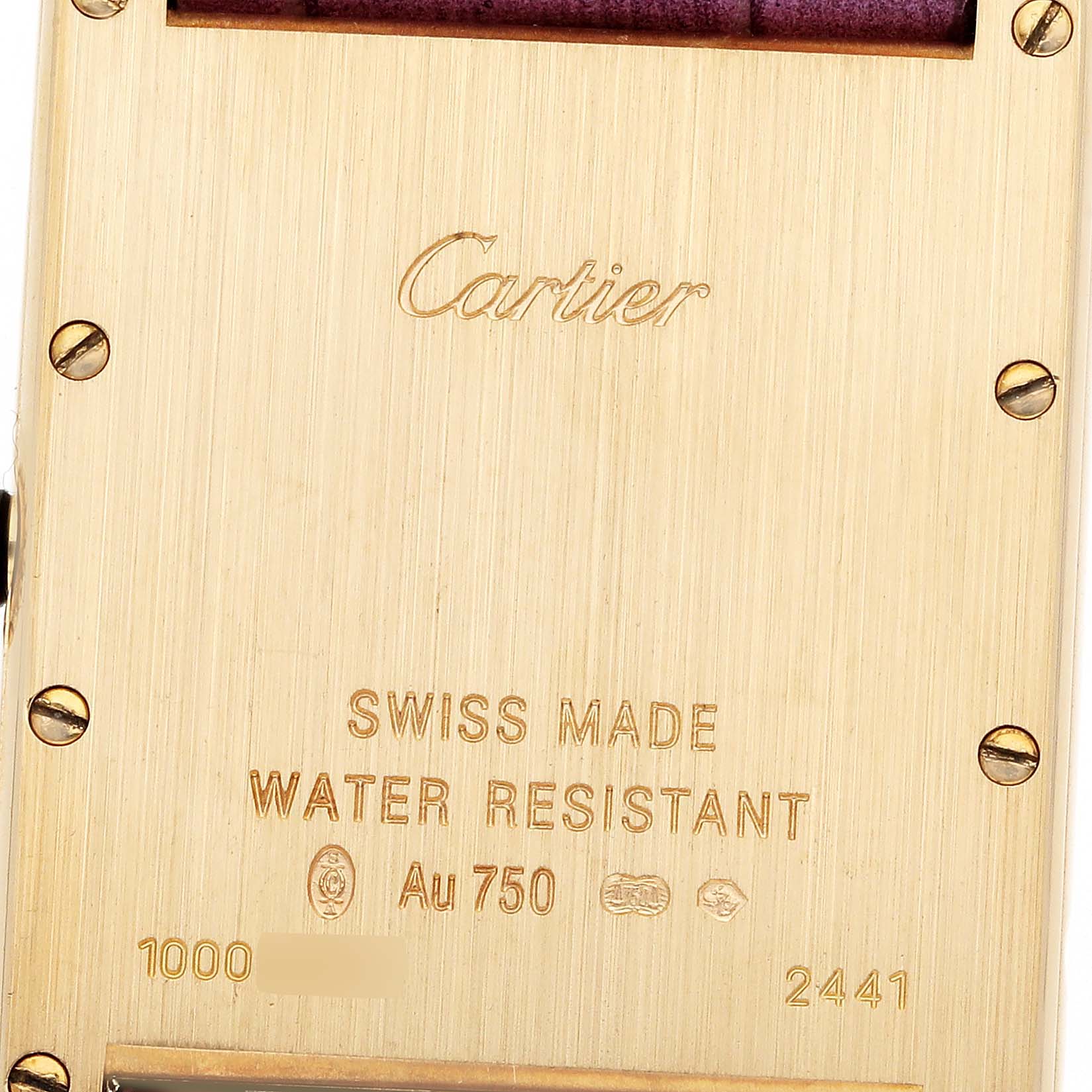 This image shows the back case of a Cartier Tank Louis W1529756 Men's Yellow Gold Silver Dial W1529756 Men's Yellow Gold Silver Dial watch, displaying the brand name, material details, and serial numbers.