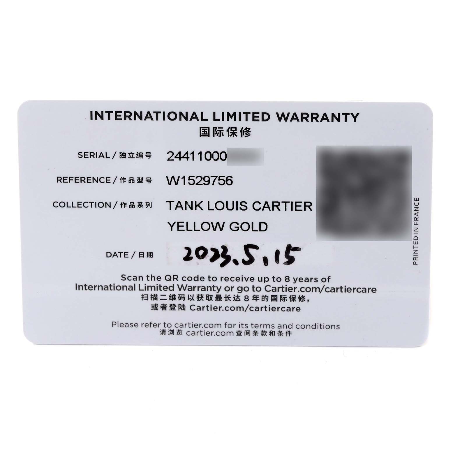 The image shows the international limited warranty card for a Tank Louis Cartier Yellow Gold watch.