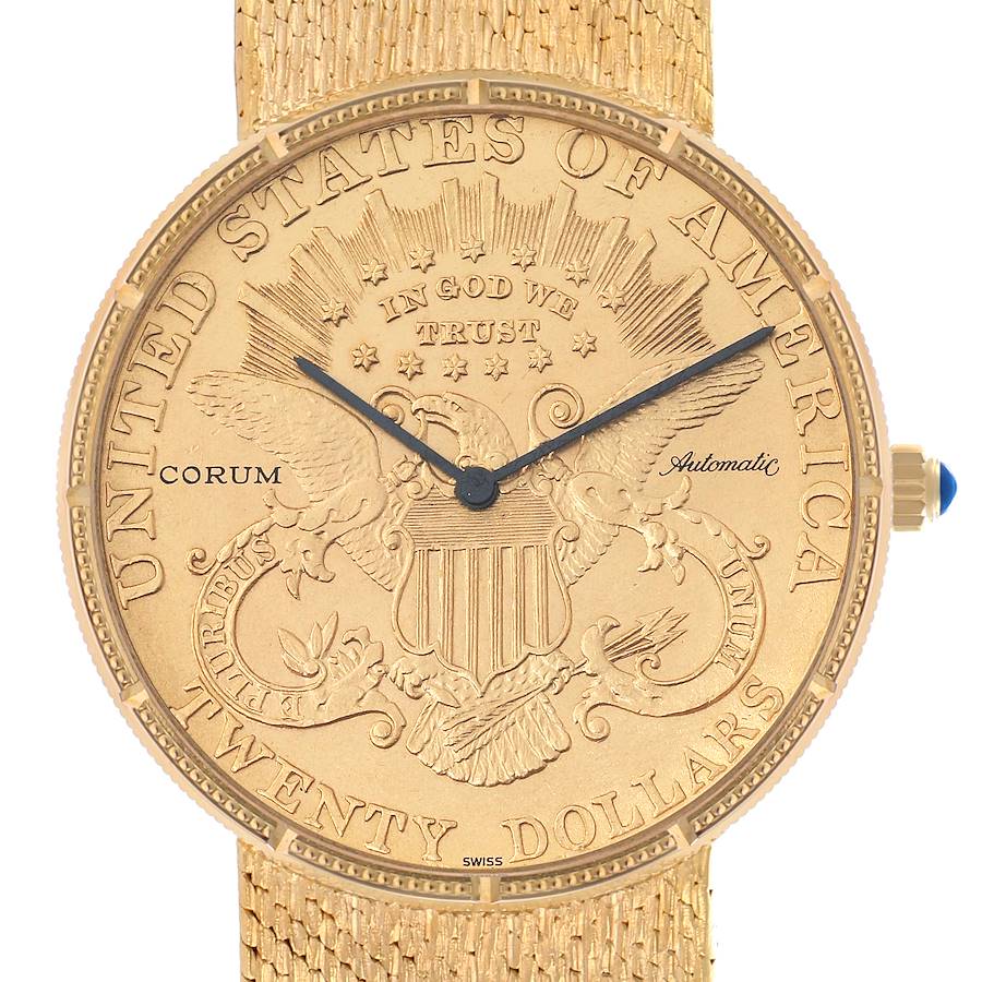 The Corum Coin Watch Men's Yellow Gold Black Dial model is shown from a front angle, highlighting its detailed gold coin dial and textured strap.