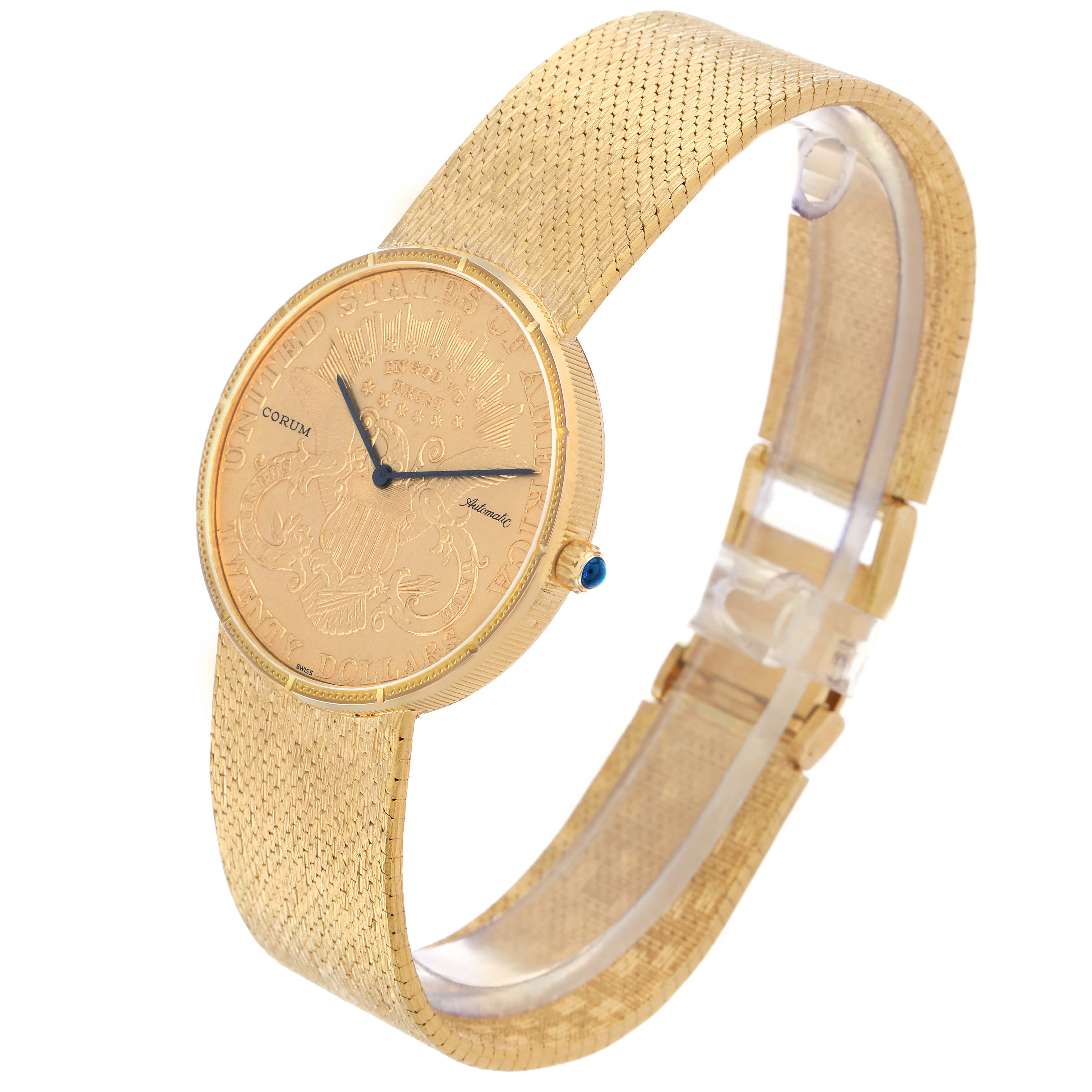 The image shows a Corum Coin Watch Men
s Yellow Gold Black Dial at a three-quarter angle, highlighting the engraved dial, textured bracelet, and side crown.