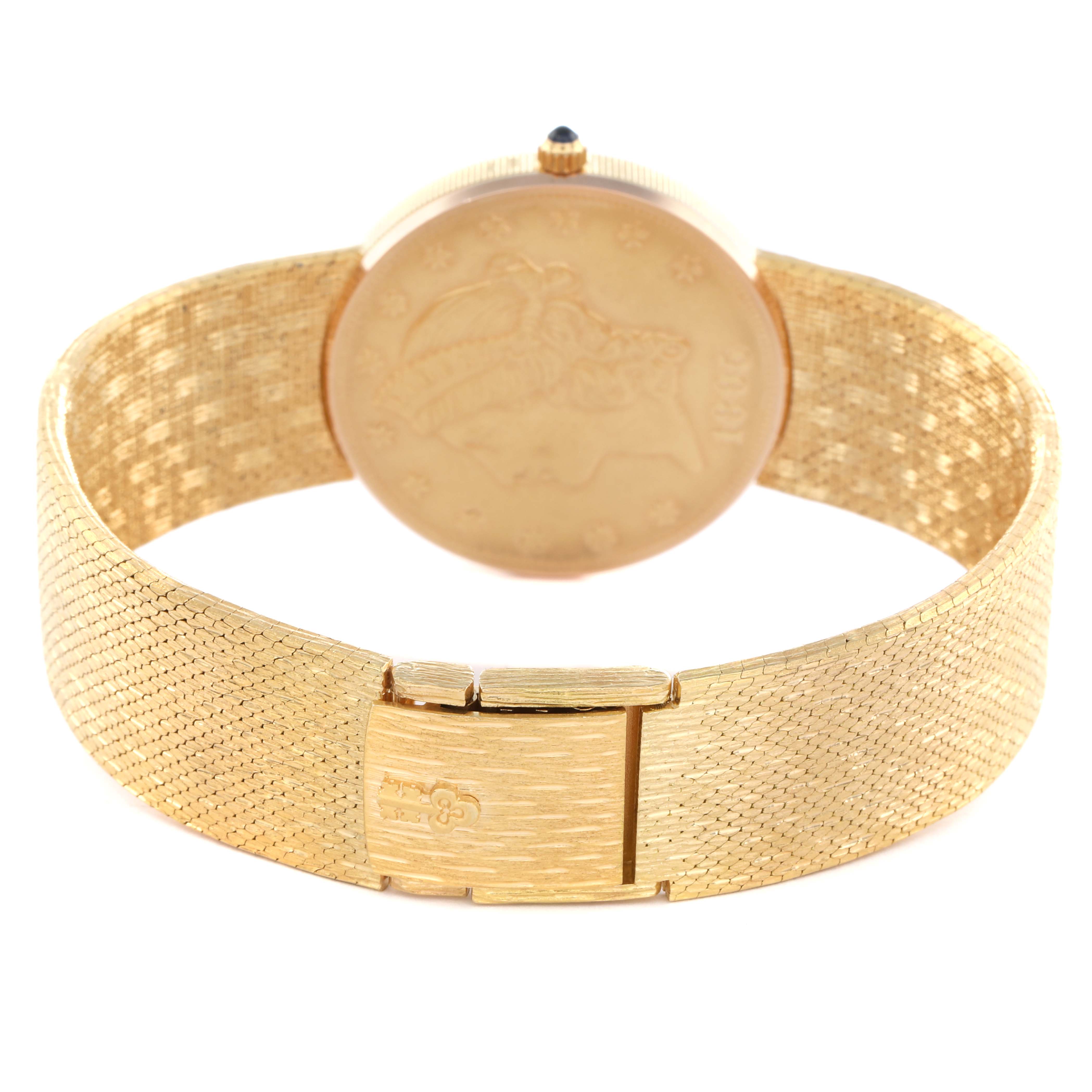 The image shows the back view of the Corum Coin Watch Men
s Yellow Gold Black Dial, highlighting its textured gold bracelet and clasp.