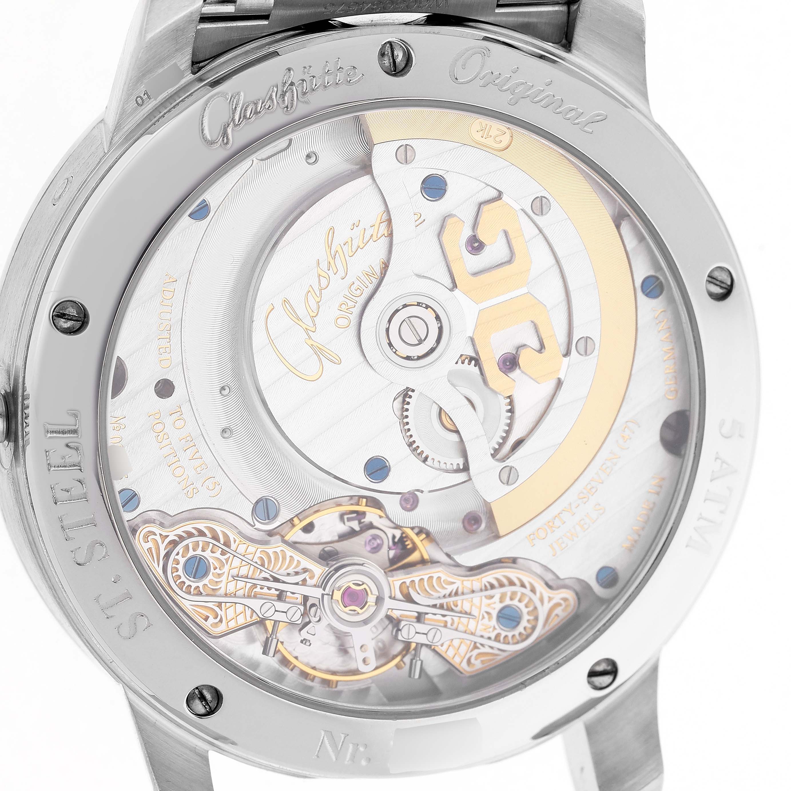 The image shows the back view of the Glashütte Pano watch, highlighting its intricate movement and the engraved case back.