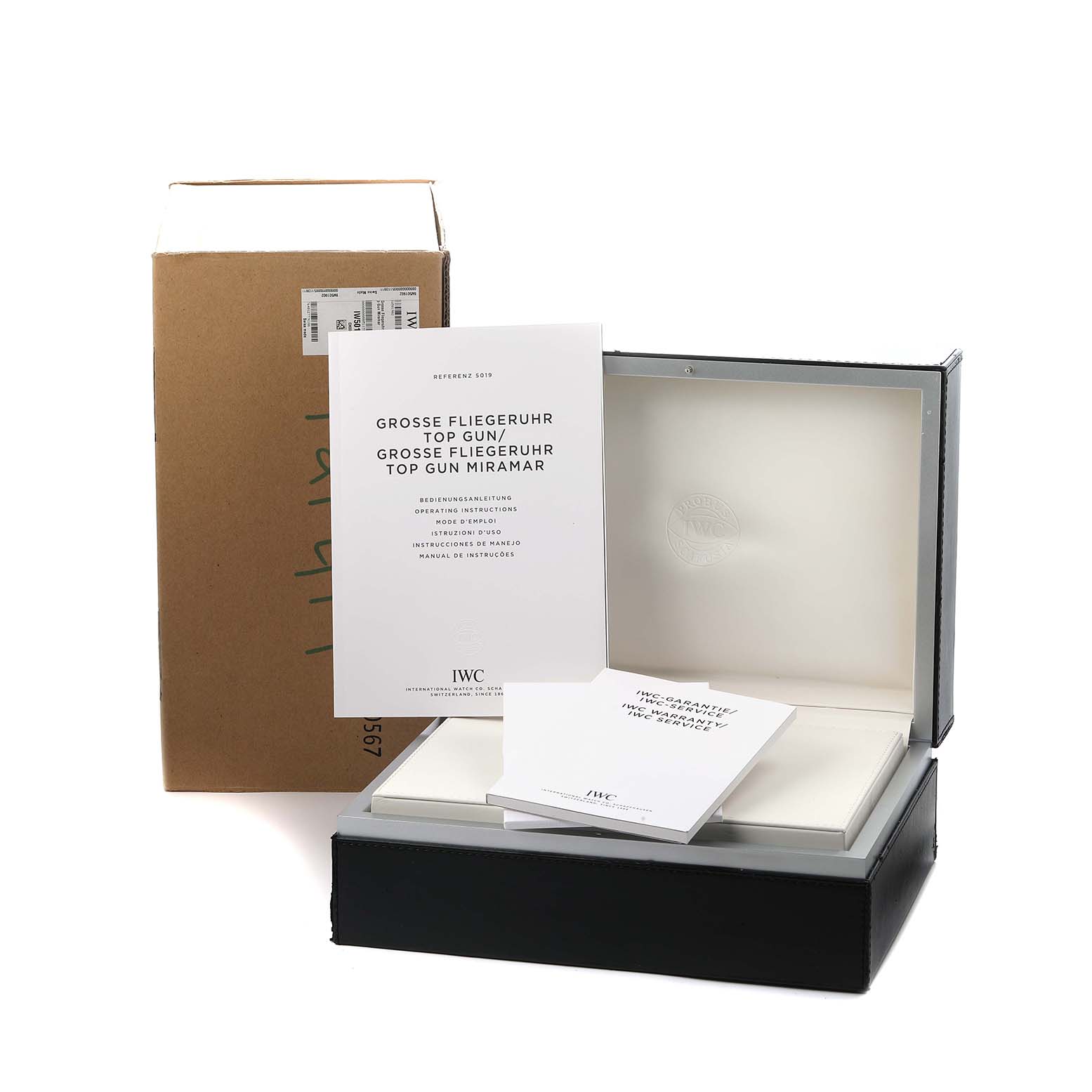 The image shows a top view of the IWC Pilot IW501902 Men
s Ceramic Grey Dial model packaging, including a box and manuals.