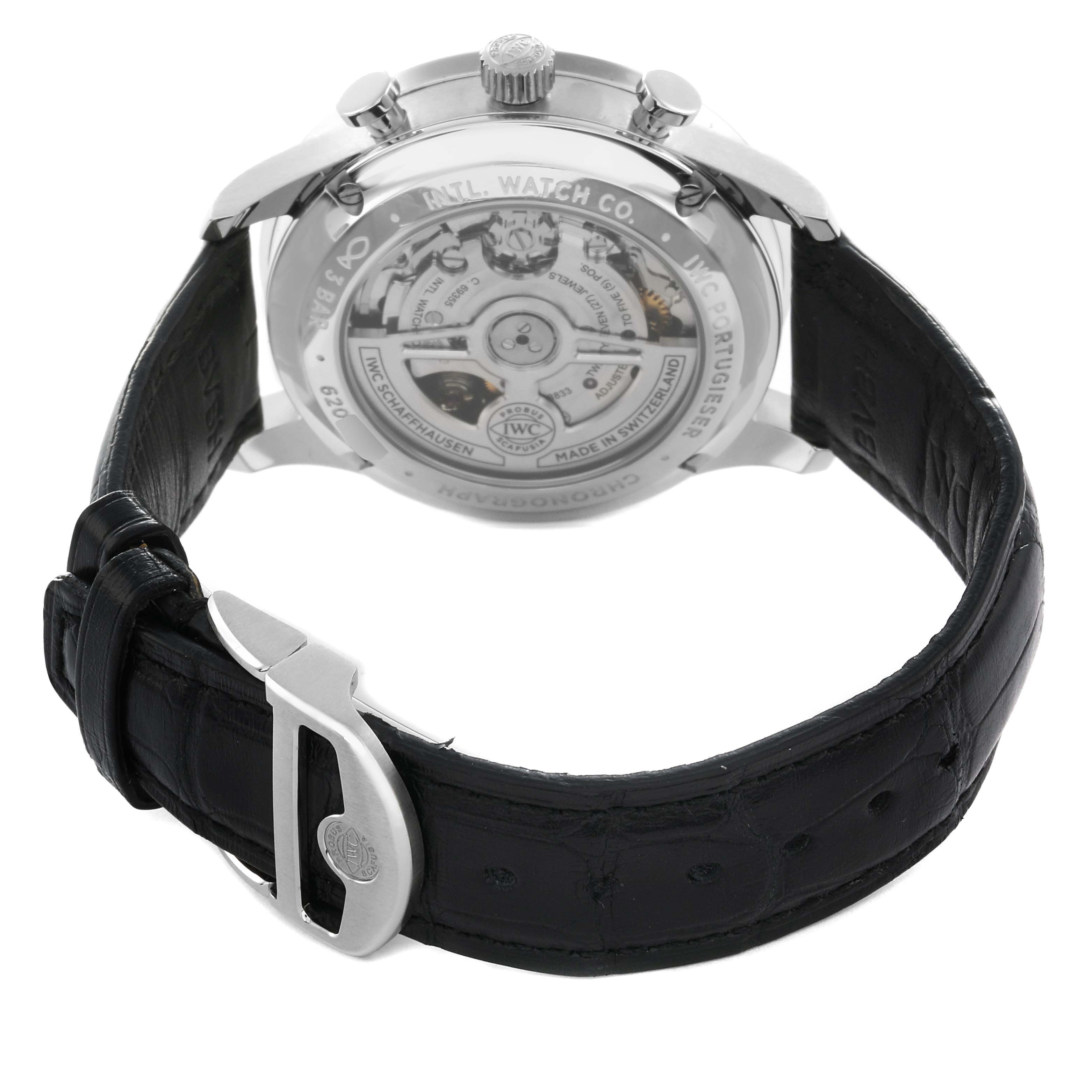 The IWC Portuguese IW371609 Men
s Stainless Steel Black Dial watch is shown from the back, highlighting the movement and leather strap with its buckle.