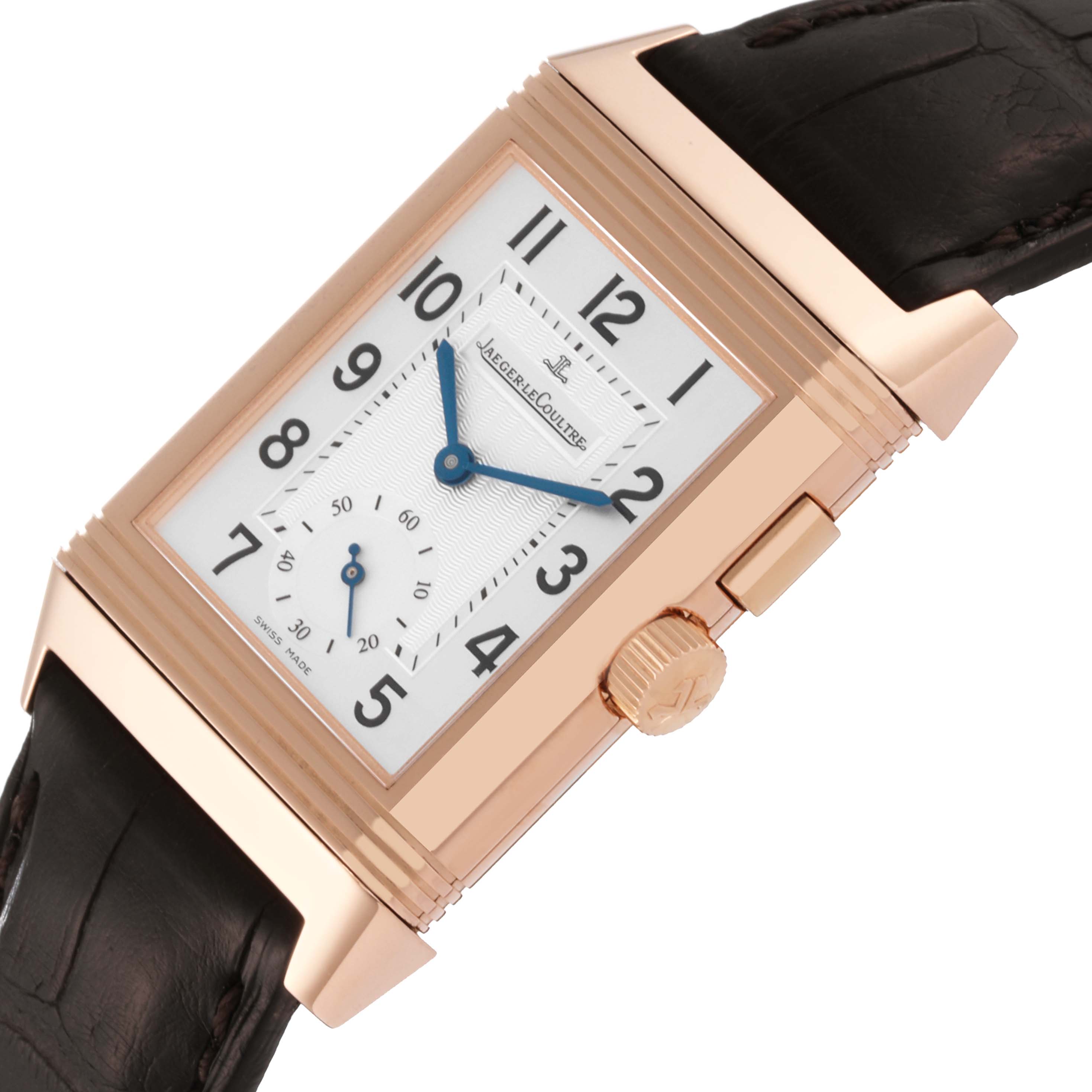 This image shows a Jaeger LeCoultre Reverso Q2712411 Men's Rose Gold Silver Dial Q2712411 Men's Rose Gold Silver Dial watch angled to display its rectangular face and crown.