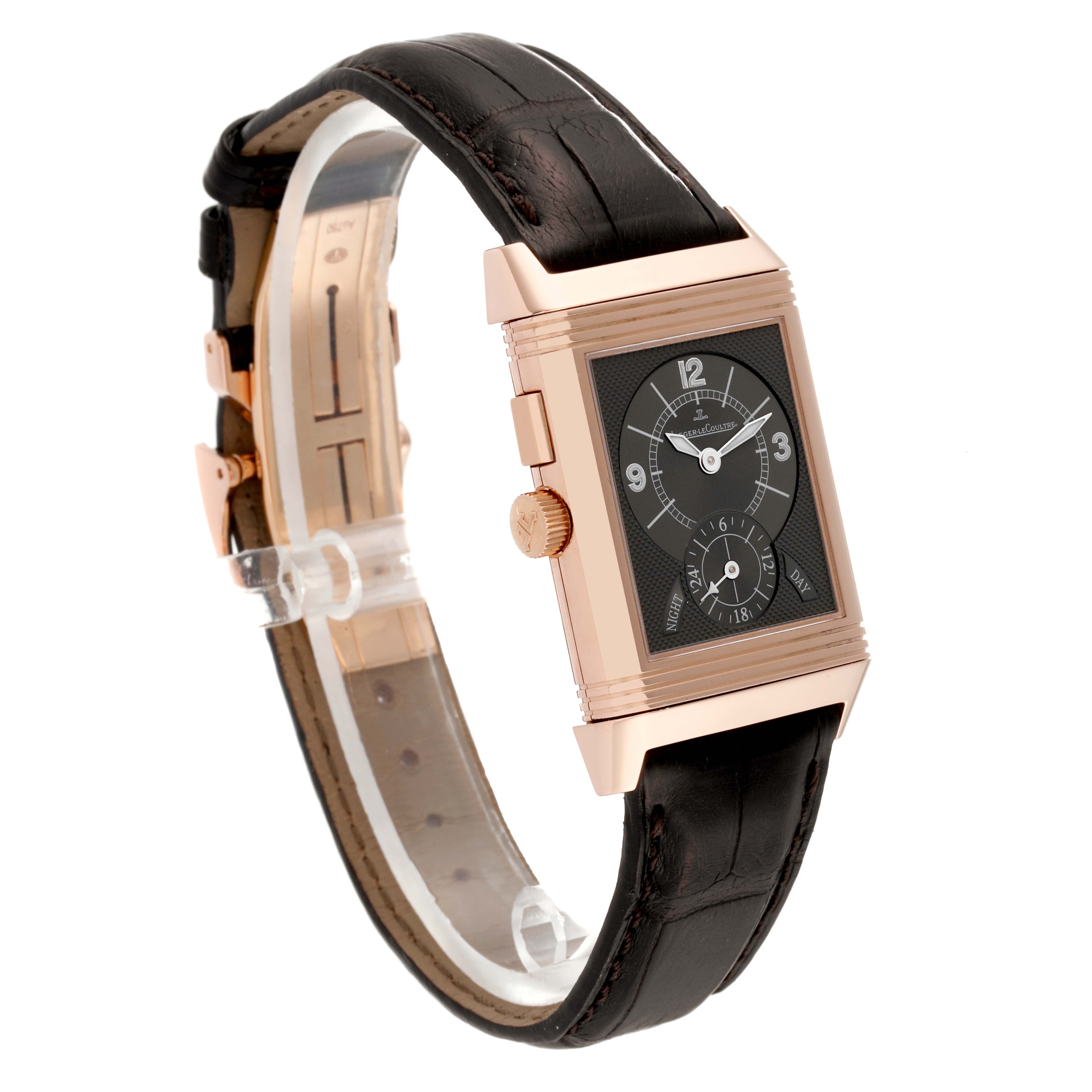 The image shows a Jaeger LeCoultre Reverso Q2712411 Men's Rose Gold Silver Dial Q2712411 Men's Rose Gold Silver Dial watch at an angled side view, highlighting its rectangular face, crown, and leather strap.