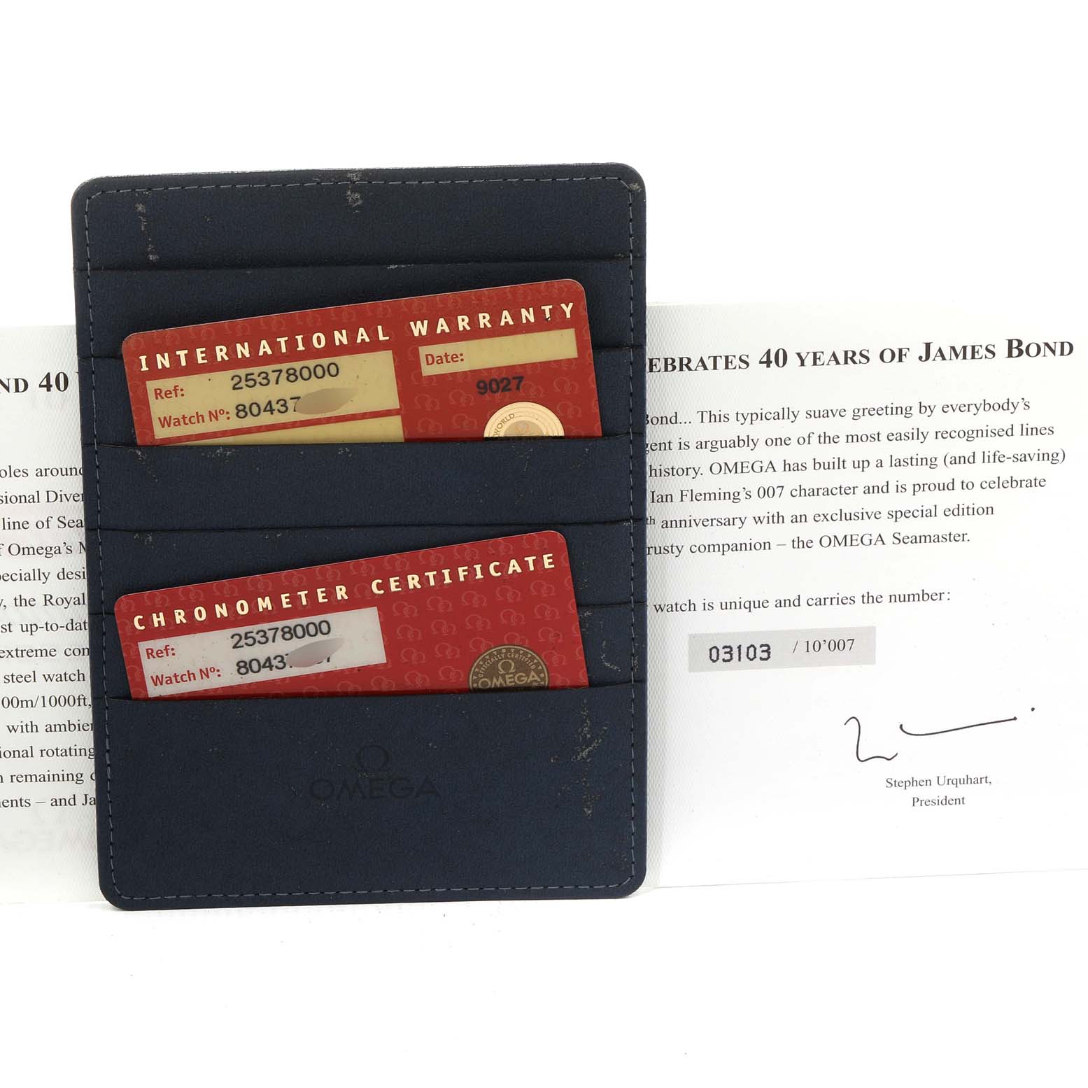 The image shows the International Warranty and Chronometer Certificate cards for an Omega Seamaster 2537.80.00 Men's Stainless Steel Blue Dial 2537.80.00 Men's Stainless Steel Blue Dial, along with a portion of a document.