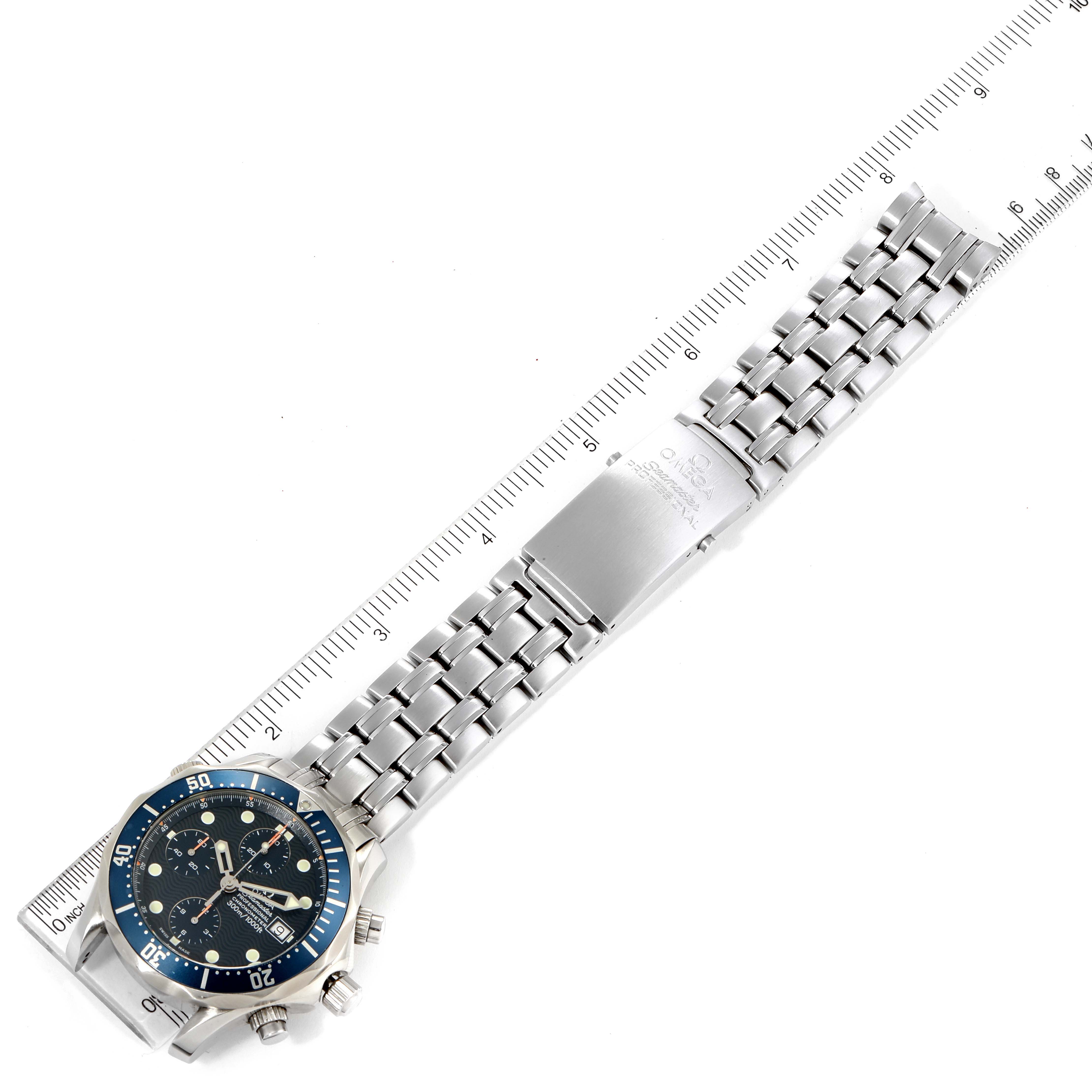 The image shows an Omega Seamaster 2599.80.00 Men's Stainless Steel Blue Dial 2599.80.00 Men's Stainless Steel Blue Dial watch with a stainless steel bracelet laid flat next to a ruler, highlighting its length and design.