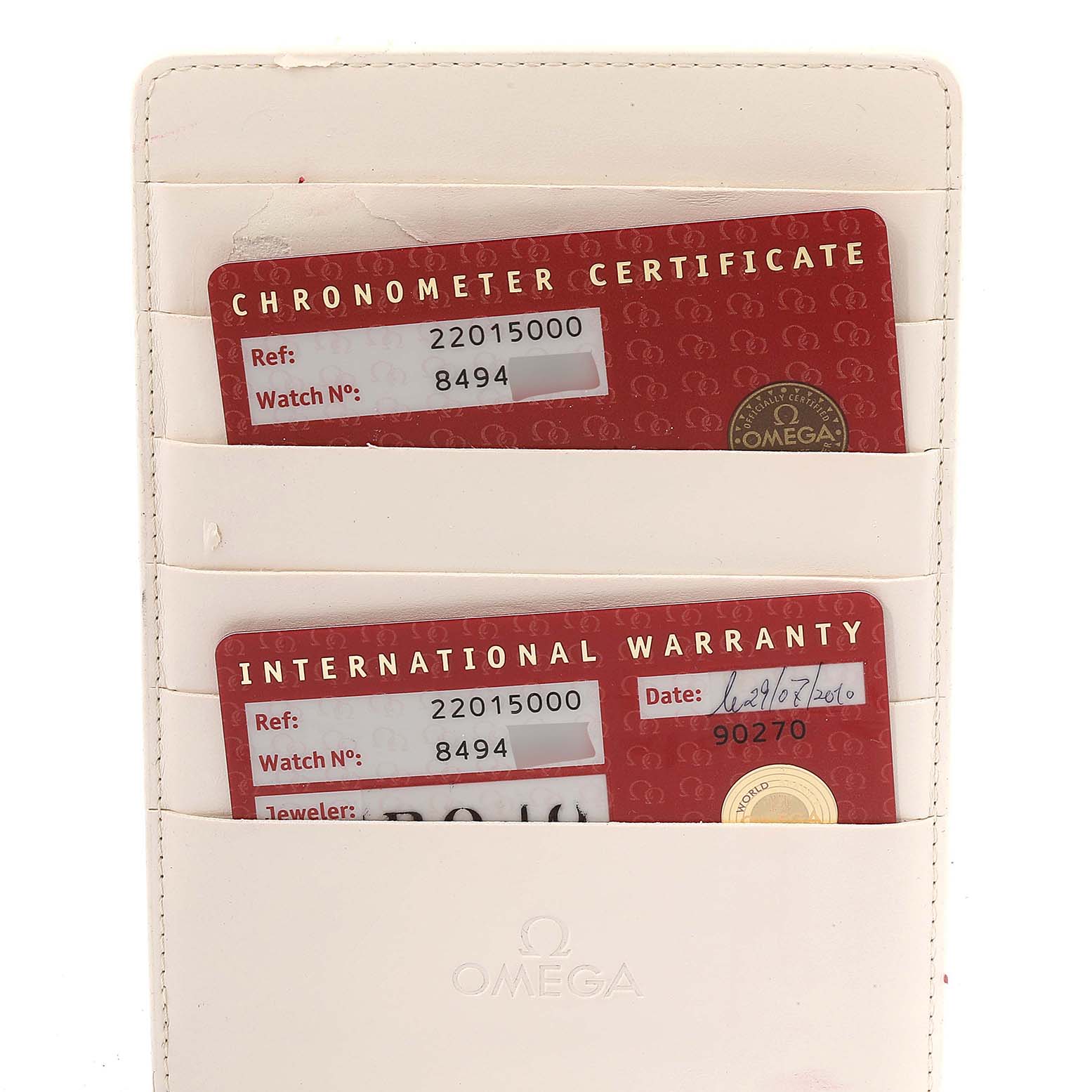 The image shows the chronometer certificate and international warranty cards for the Omega Planet Ocean 2201.50.00 Men's Stainless Steel Black Dial 2201.50.00 Men's Stainless Steel Black Dial watch.