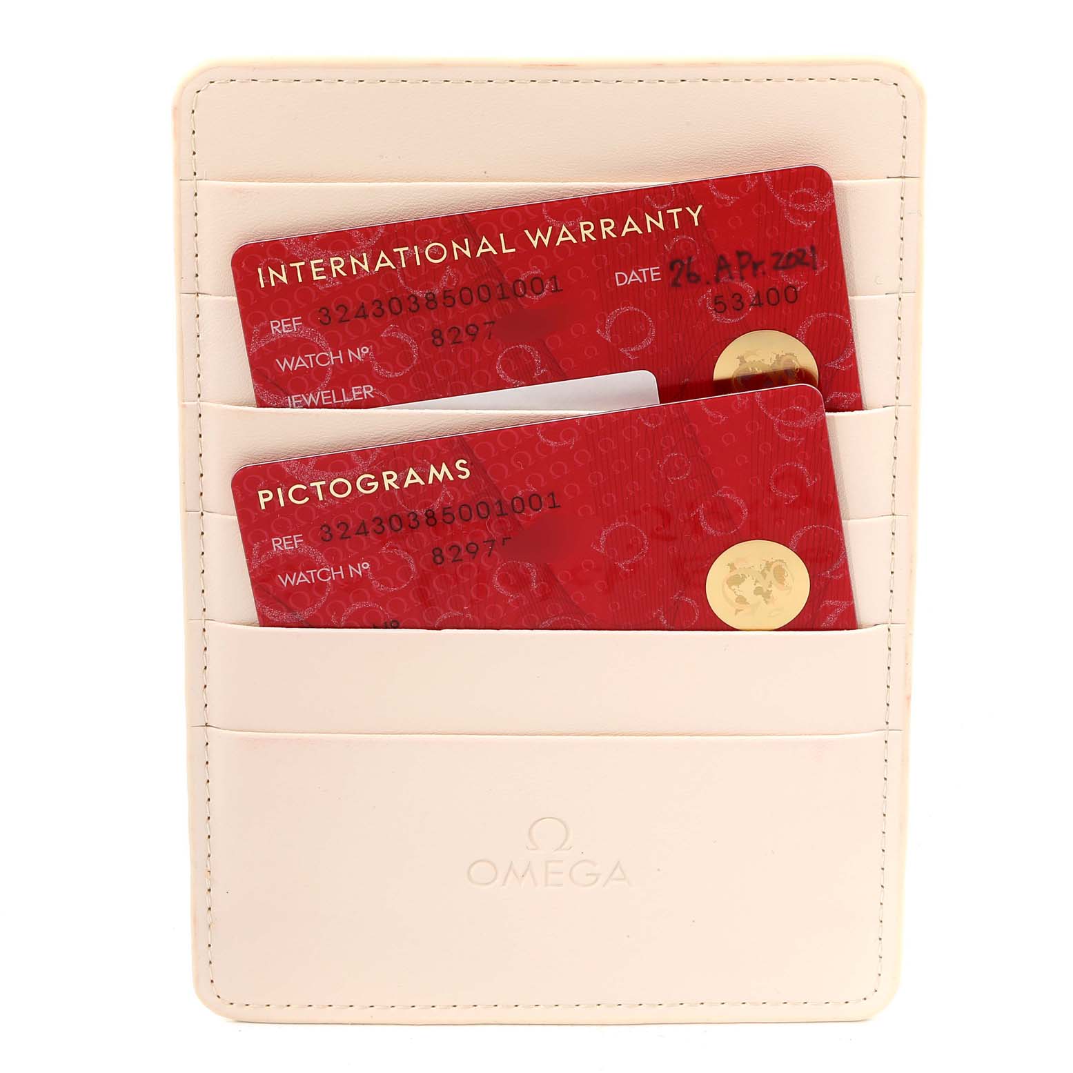 The image shows Omega Speedmaster 324.30.38.50.01.001 Men
s Stainless Steel Black Dial 324.30.38.50.01.001 Men
s Stainless Steel Black Dial
s international warranty and pictogram cards in a cream holder.