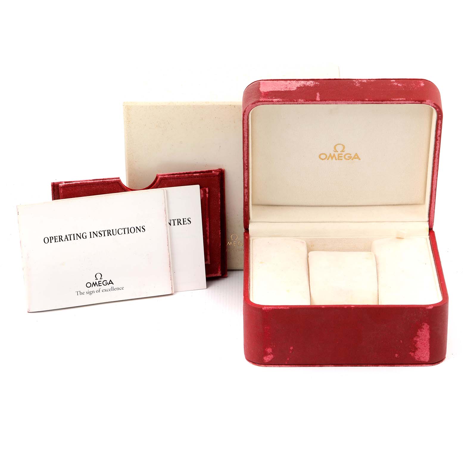 The image shows a red Omega Speedmaster 3520.50.00 Men
s Stainless Steel Black Dial 3520.50.00 Men
s Stainless Steel Black Dial watch box, operating instructions manual, and warranty cards from a front angle.