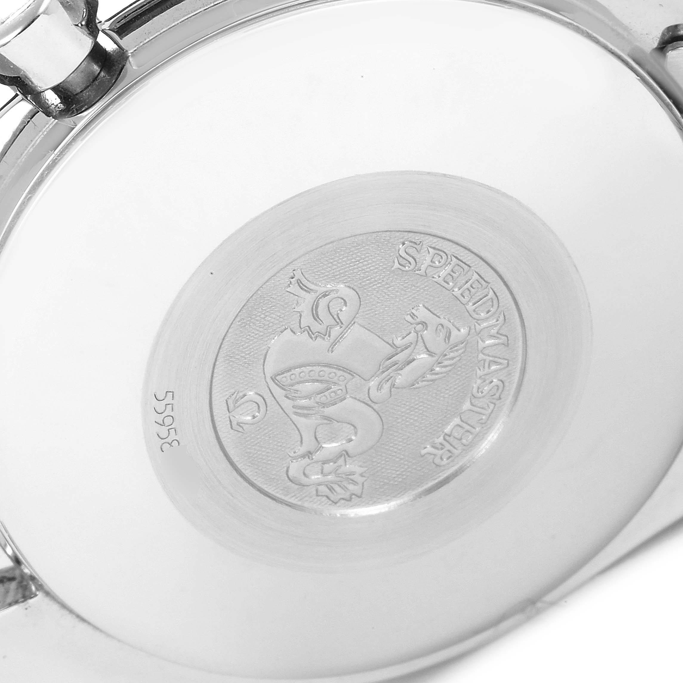 The image shows the back case of an Omega Speedmaster 3520.50.00 Men
s Stainless Steel Black Dial 3520.50.00 Men
s Stainless Steel Black Dial watch, highlighting its engraved emblem and model details.