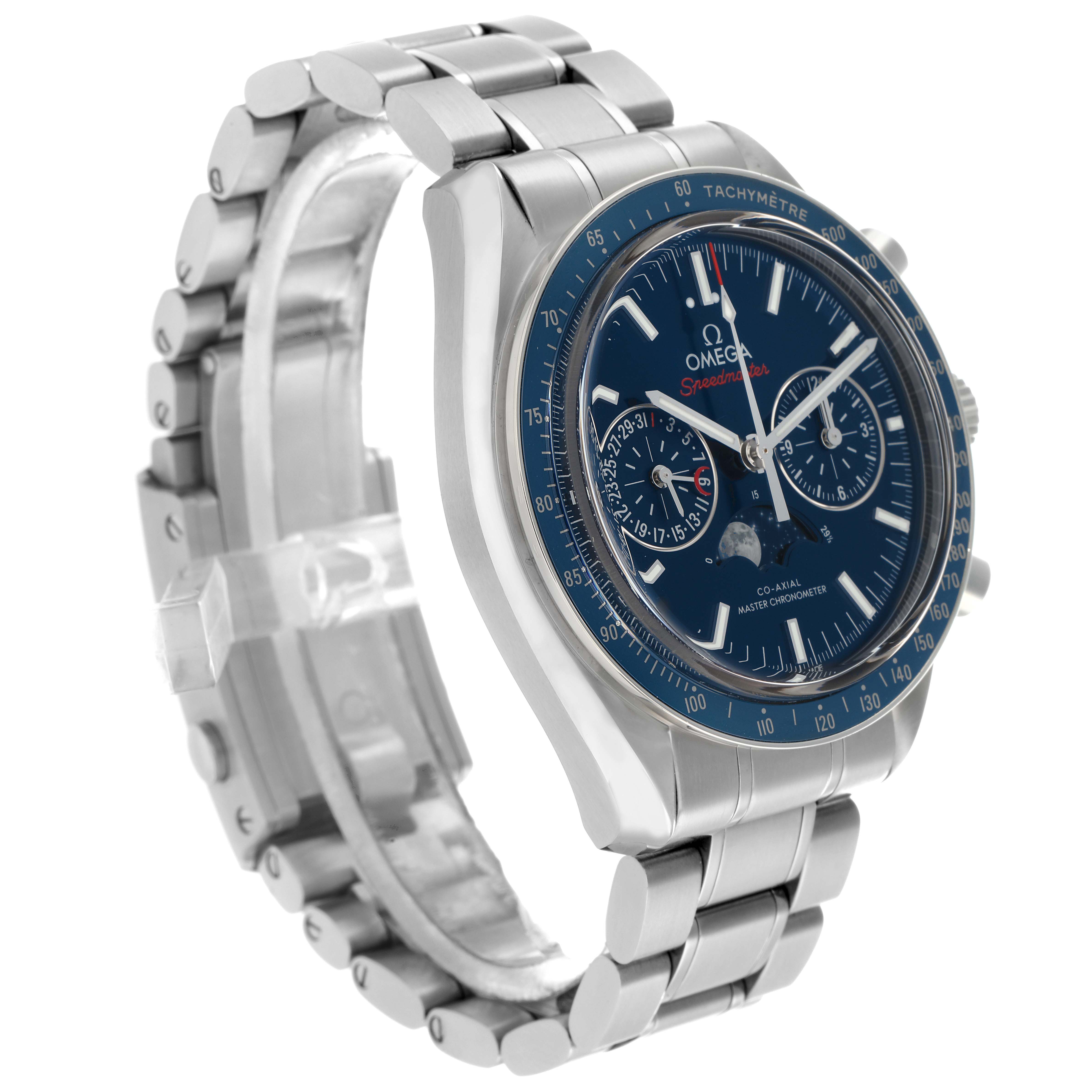 The Omega Speedmaster 304.33.44.52.03.001 Men
s Stainless Steel Blue Dial watch is shown at a three-quarter angle, highlighting the dial, bezel, pushers, and metal bracelet.