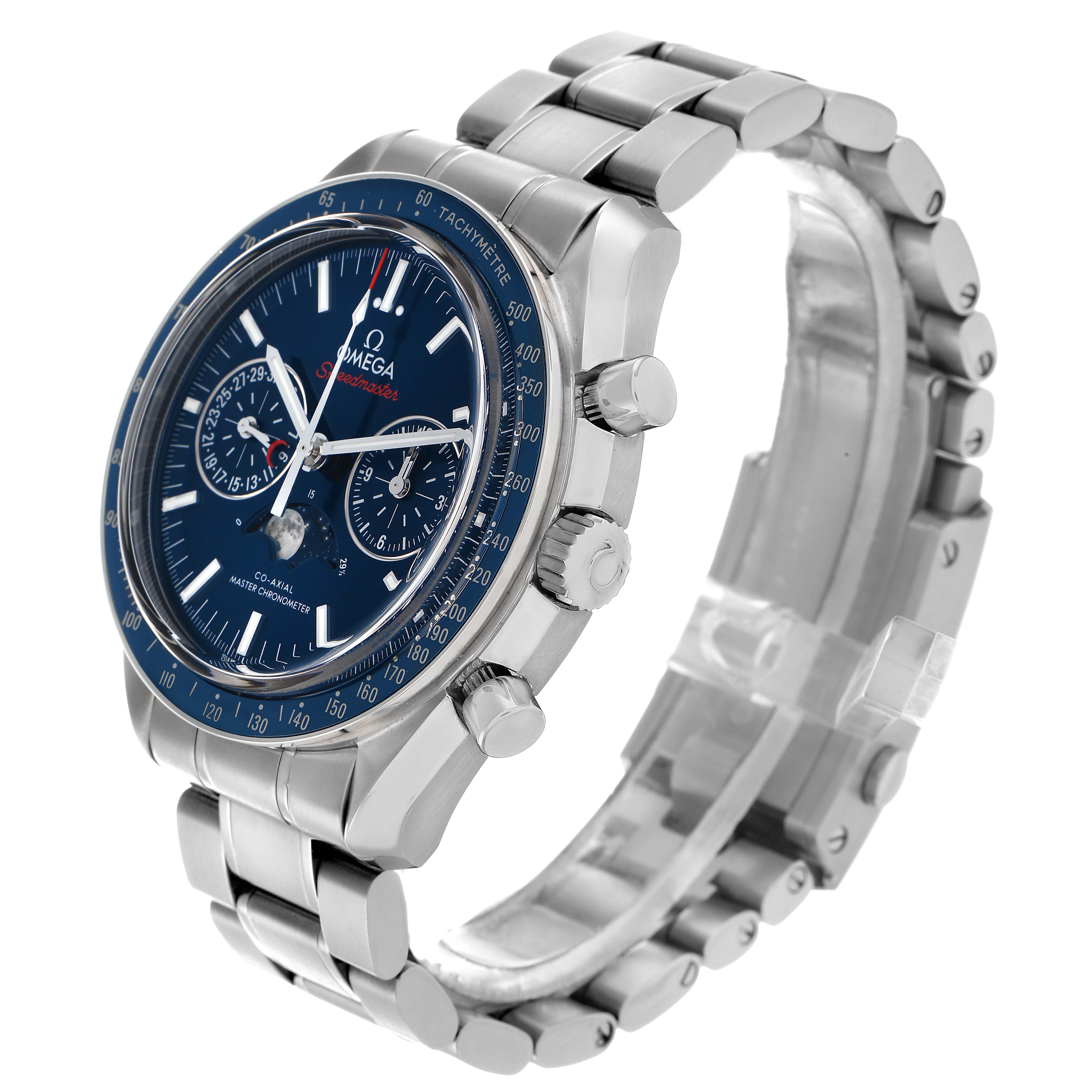 The Omega Speedmaster 304.33.44.52.03.001 Men
s Stainless Steel Blue Dial watch is shown at an angle highlighting the face, bezel, crown, pushers, and metal bracelet.