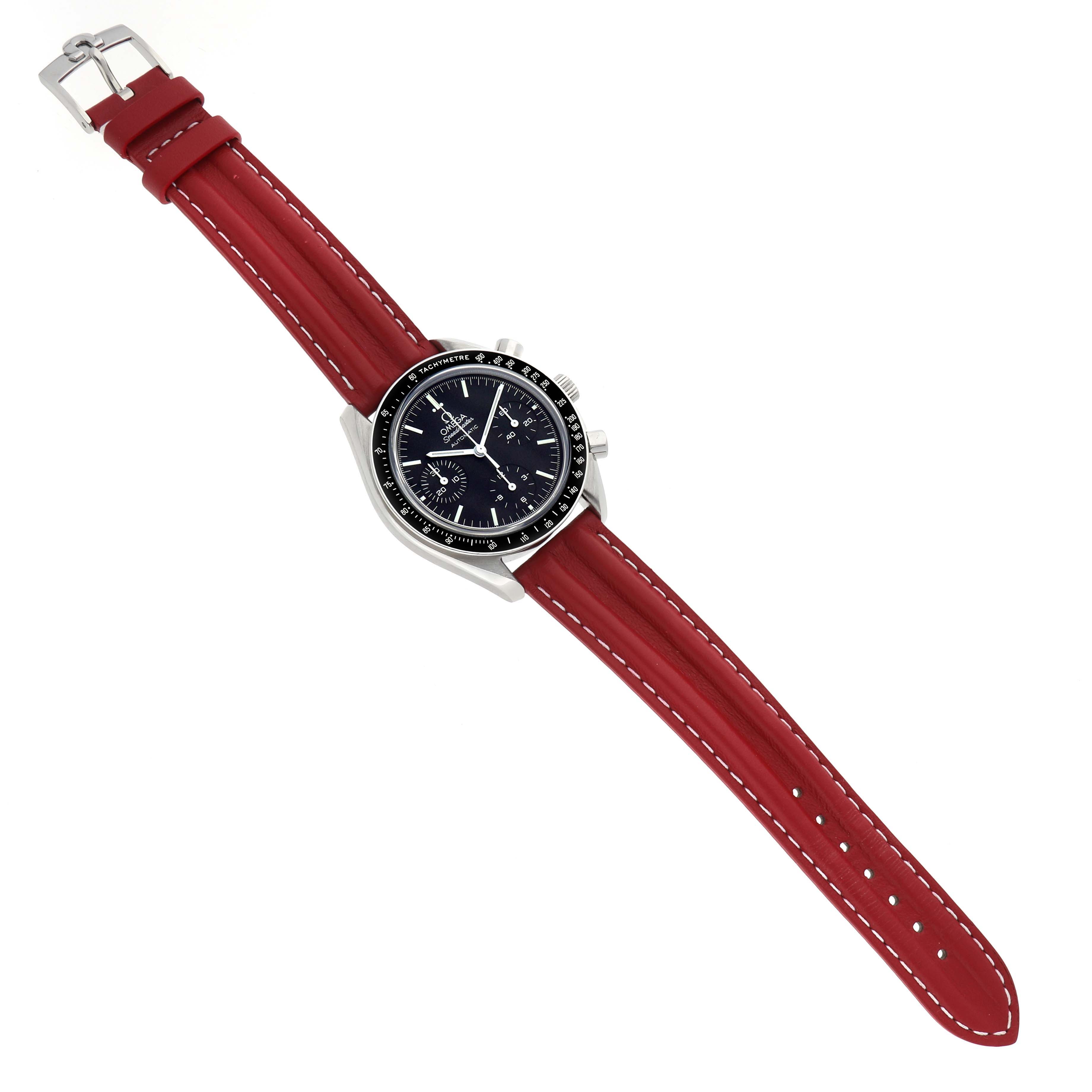 The Omega Speedmaster 3539.50.00 Men
s Stainless Steel Black Dial watch is shown from a top-down angle, highlighting its red strap and black dial with a tachymeter bezel.