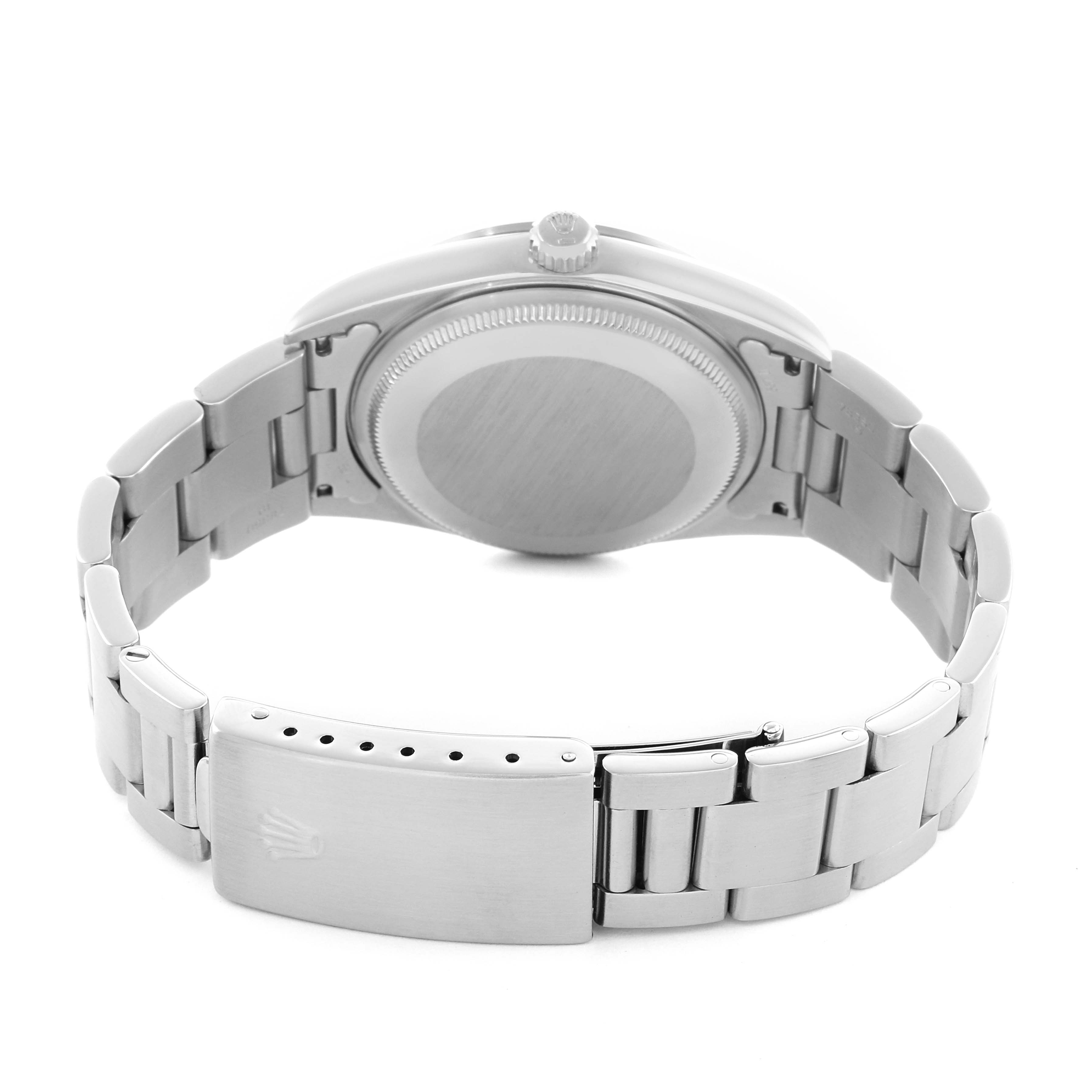 The Rolex Air-King 14000 Men
s Stainless Steel Blue Dial watch is shown from the back, highlighting the case back, bracelet, and clasp.