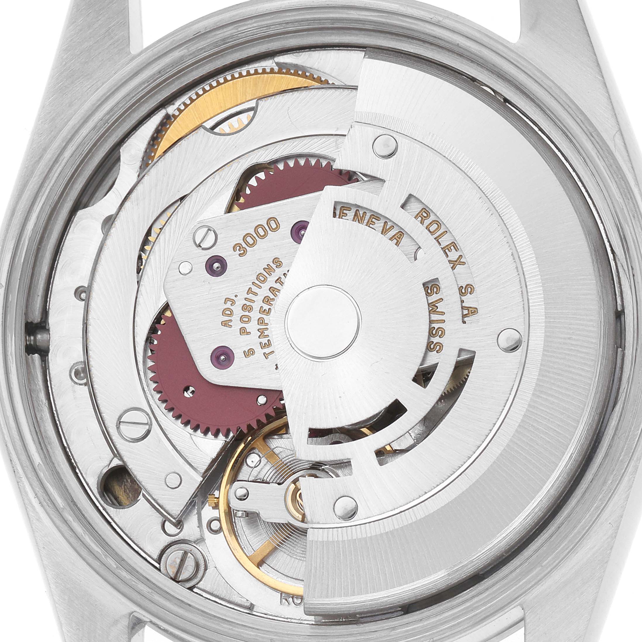 The image shows the movement of a Rolex Air-King 14000 Men
s Stainless Steel Blue Dial watch from a back angle, highlighting gears and rotors.